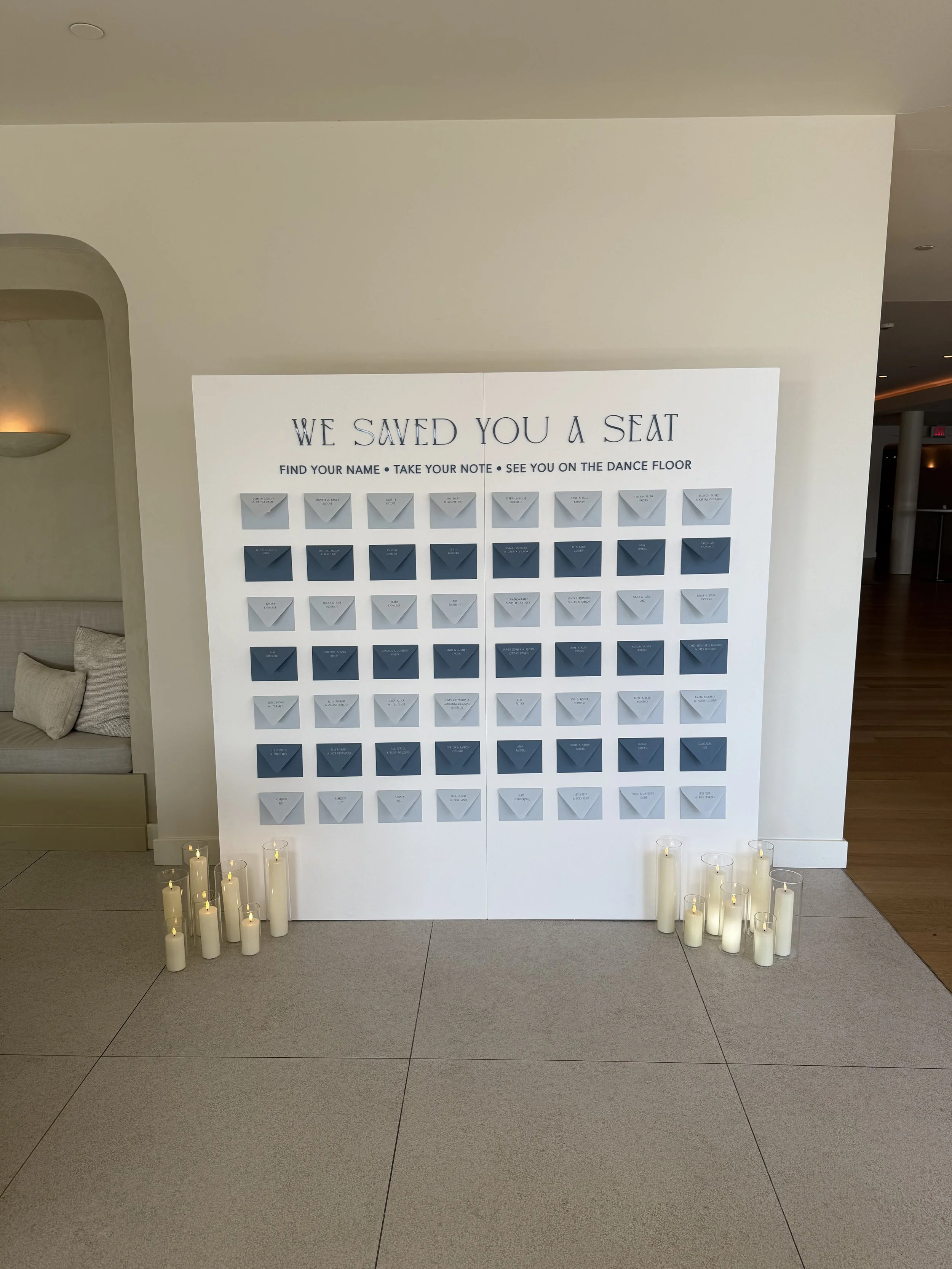 Custom guest note envelope escort card wall at The Lakehouse in Halifax, Massachusetts