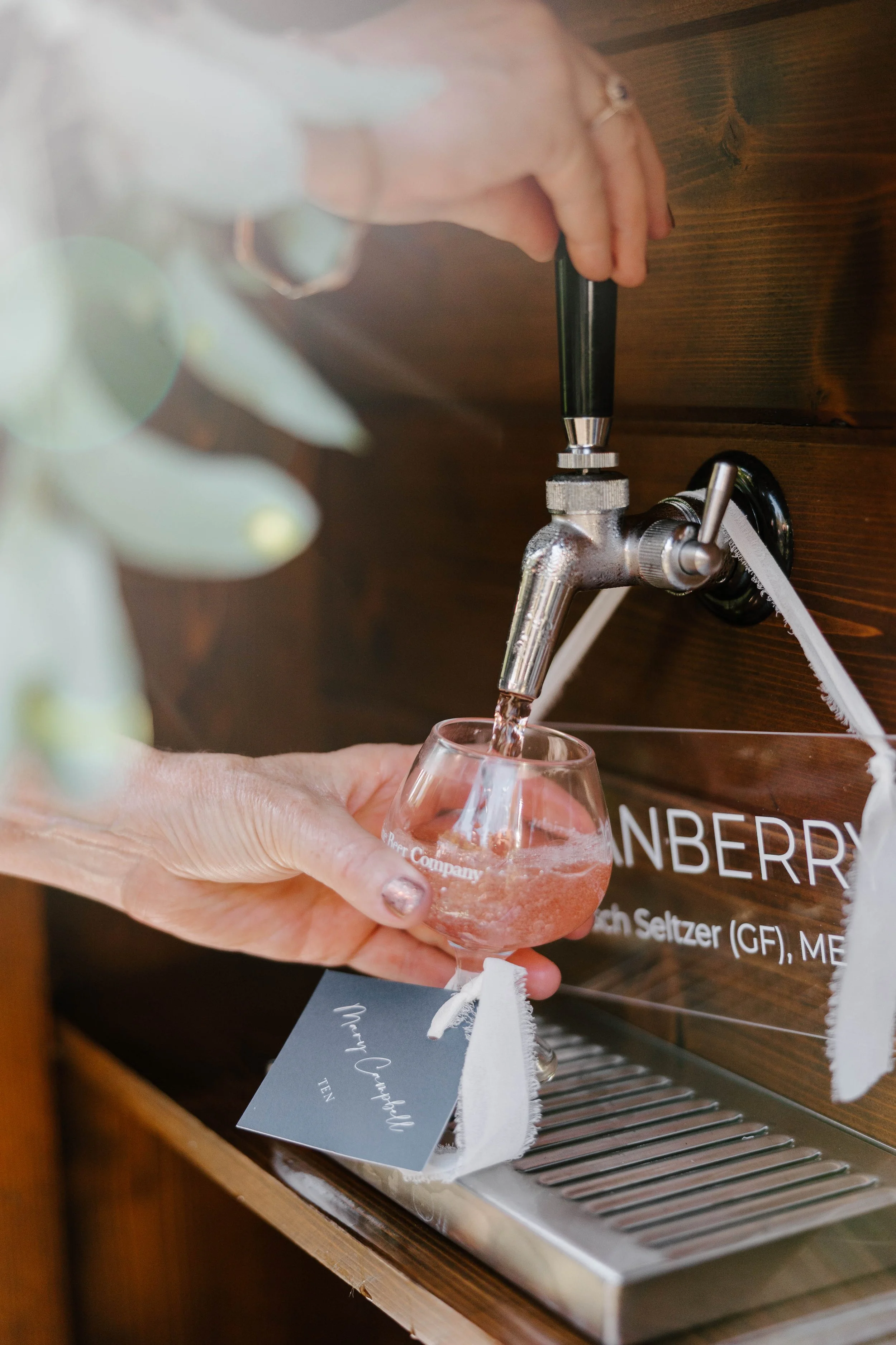 Navy blue wedding escort tags with white typography and chiffon ribbon for a coastal wedding at the Inn at Diamond Cove