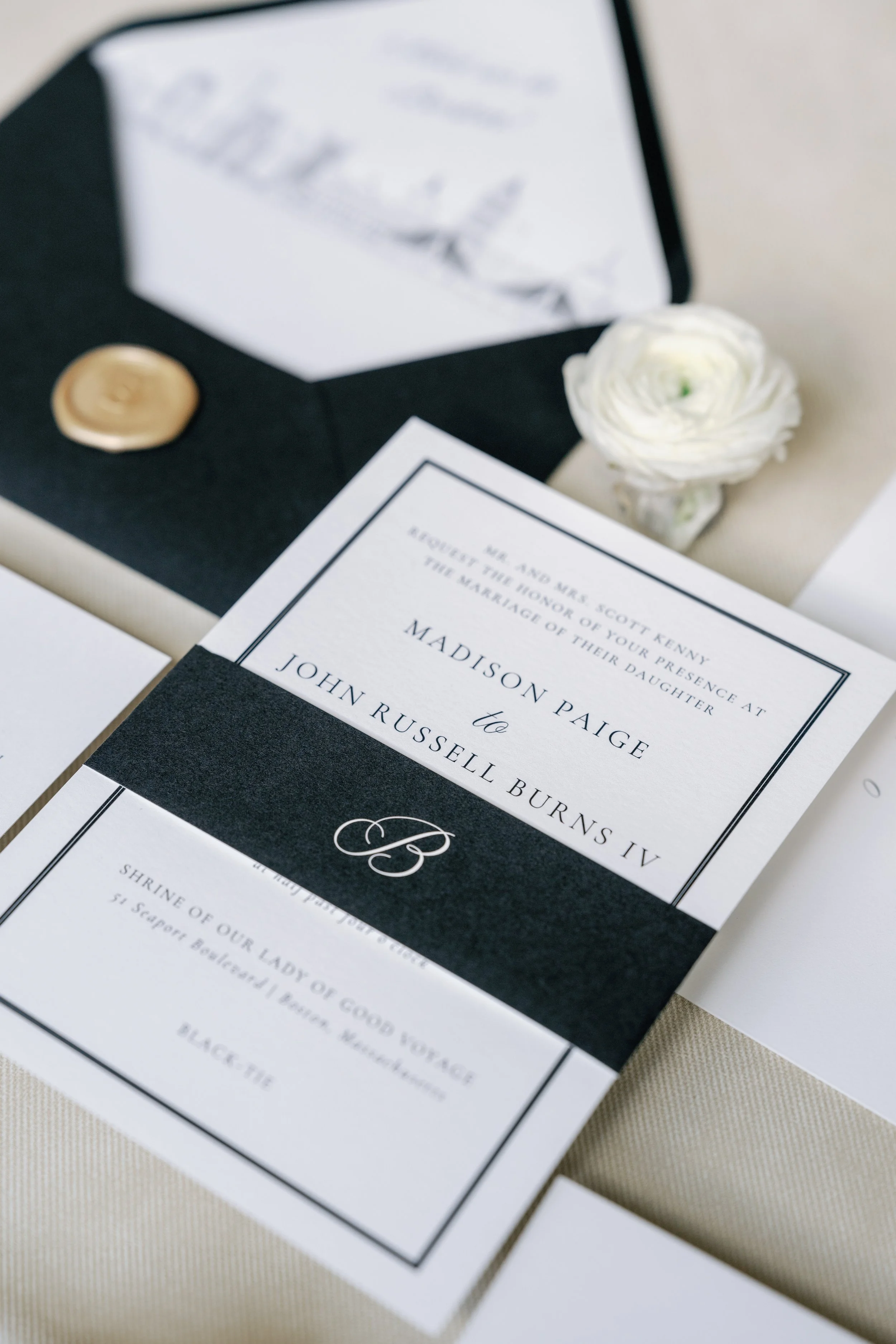 Custom bespoke wedding invitation suite featuring a modern elegant layout, border, and Boston skyline artwork and belly band at a Boston wedding reception - State Room
