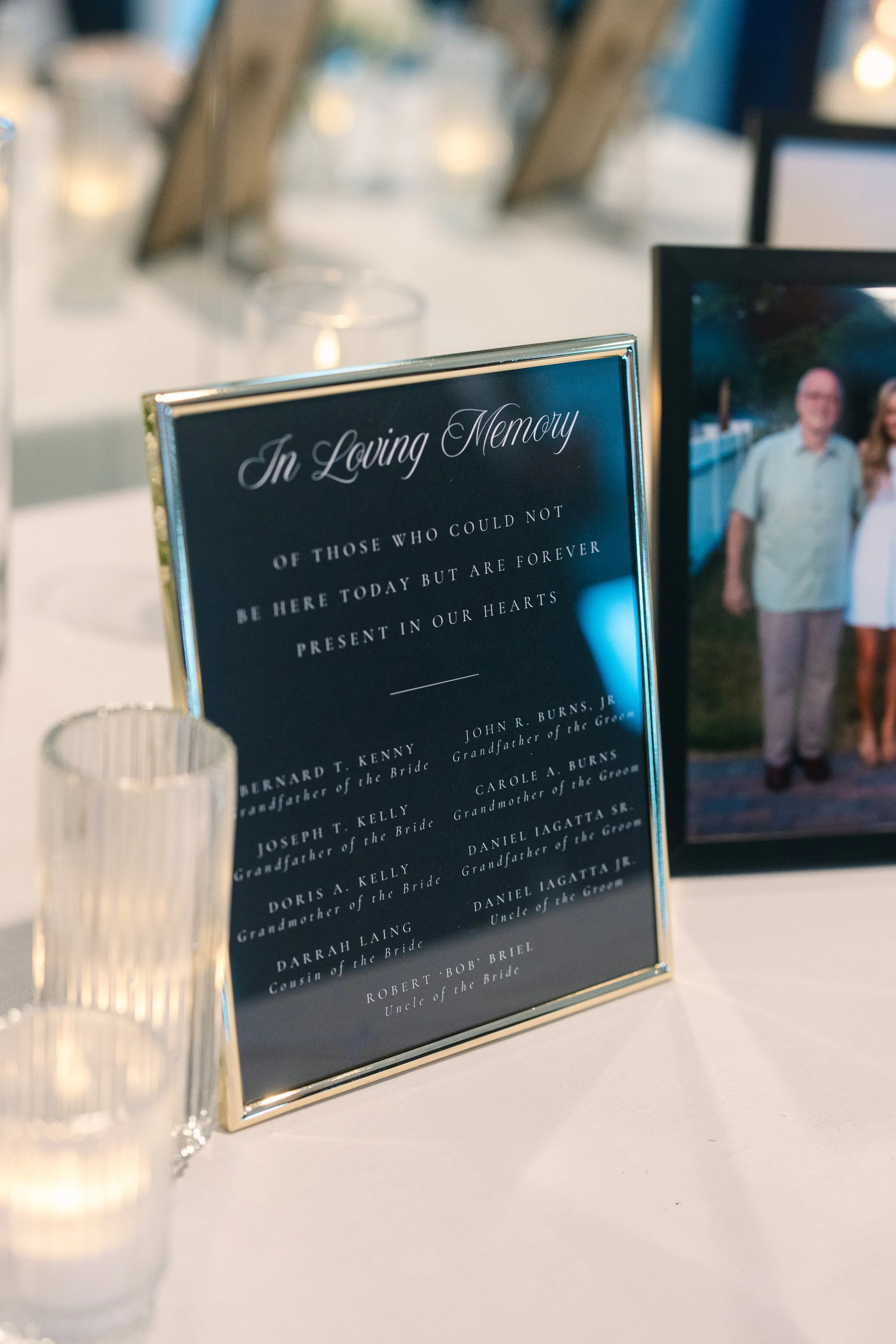 Personalized black and white wedding memorial sign on luxury card stock featuring a modern elegant layout at a Boston wedding reception - State Room