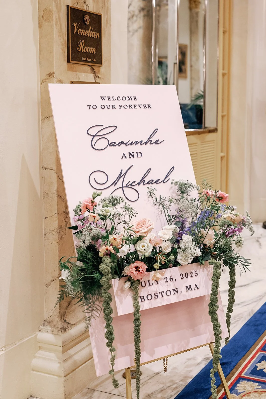 Custom light pink floral wooden welcome sign at the iconic Fairmont Copley Plaza