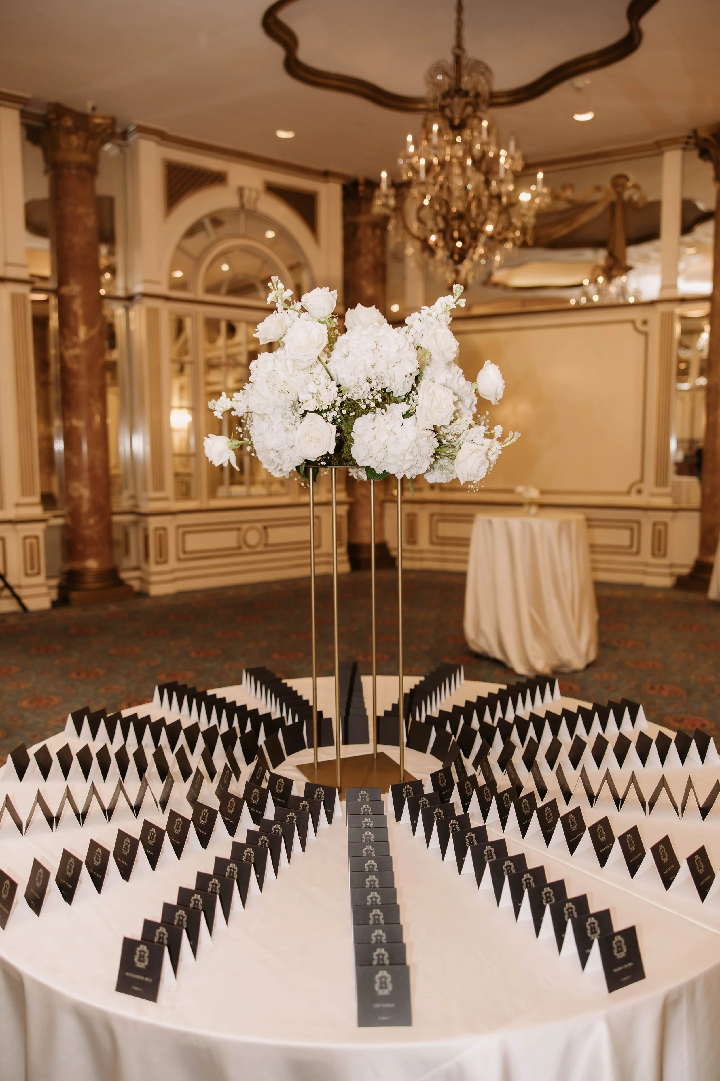 gold and black wedding escort card seating display at the fairmont copley plaza