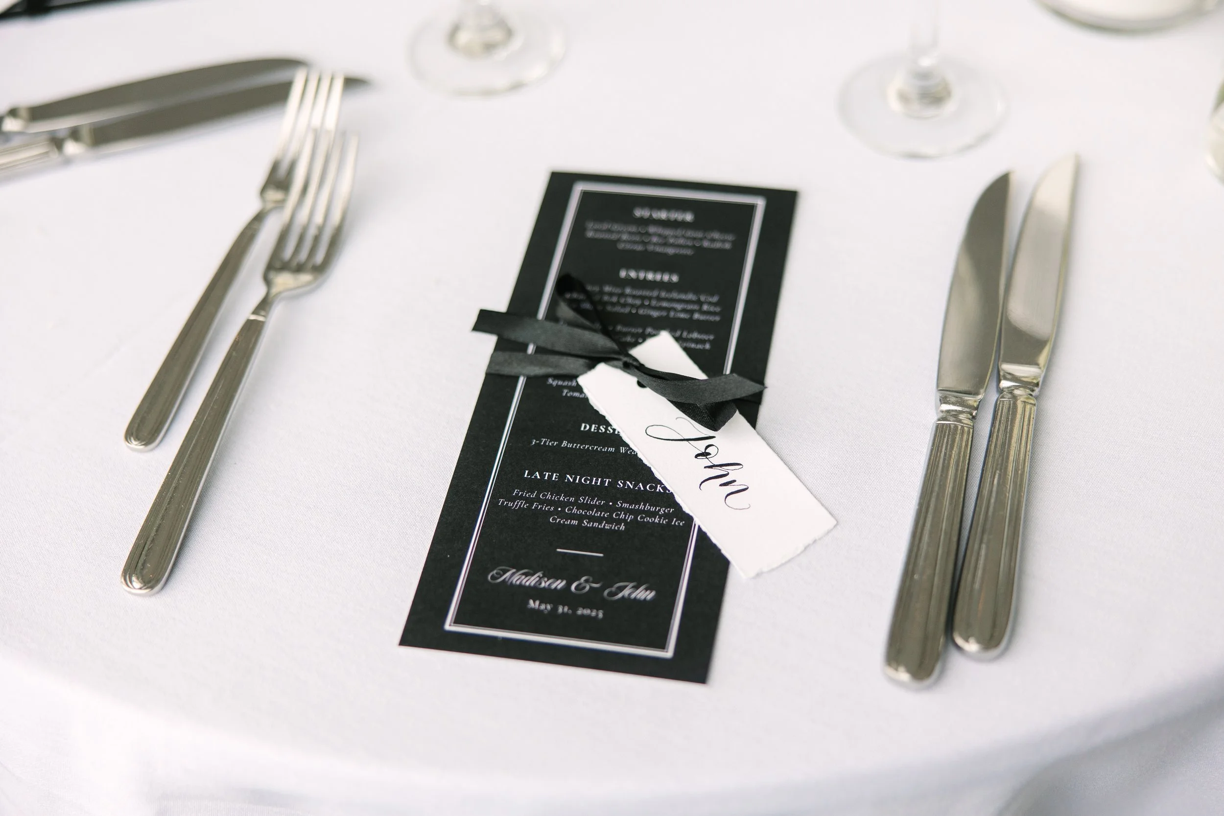 Personalized black and white wedding dinner menu with calligraphy name tag on luxury card stock featuring a modern elegant layout at a Boston wedding reception - State Room