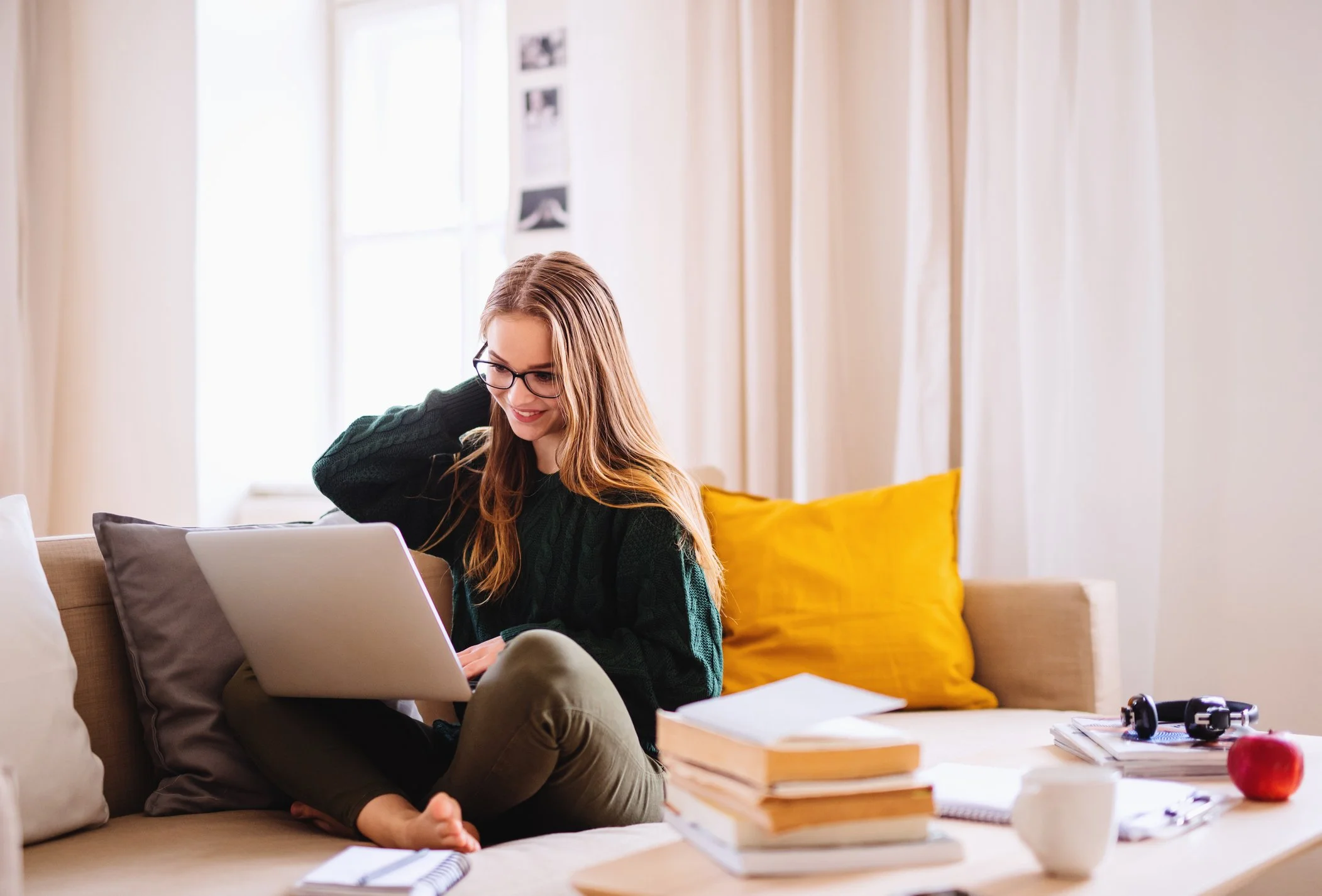 Teen sitting at desk feeling unmotivated and overwhelmed while trying to focus on schoolwork