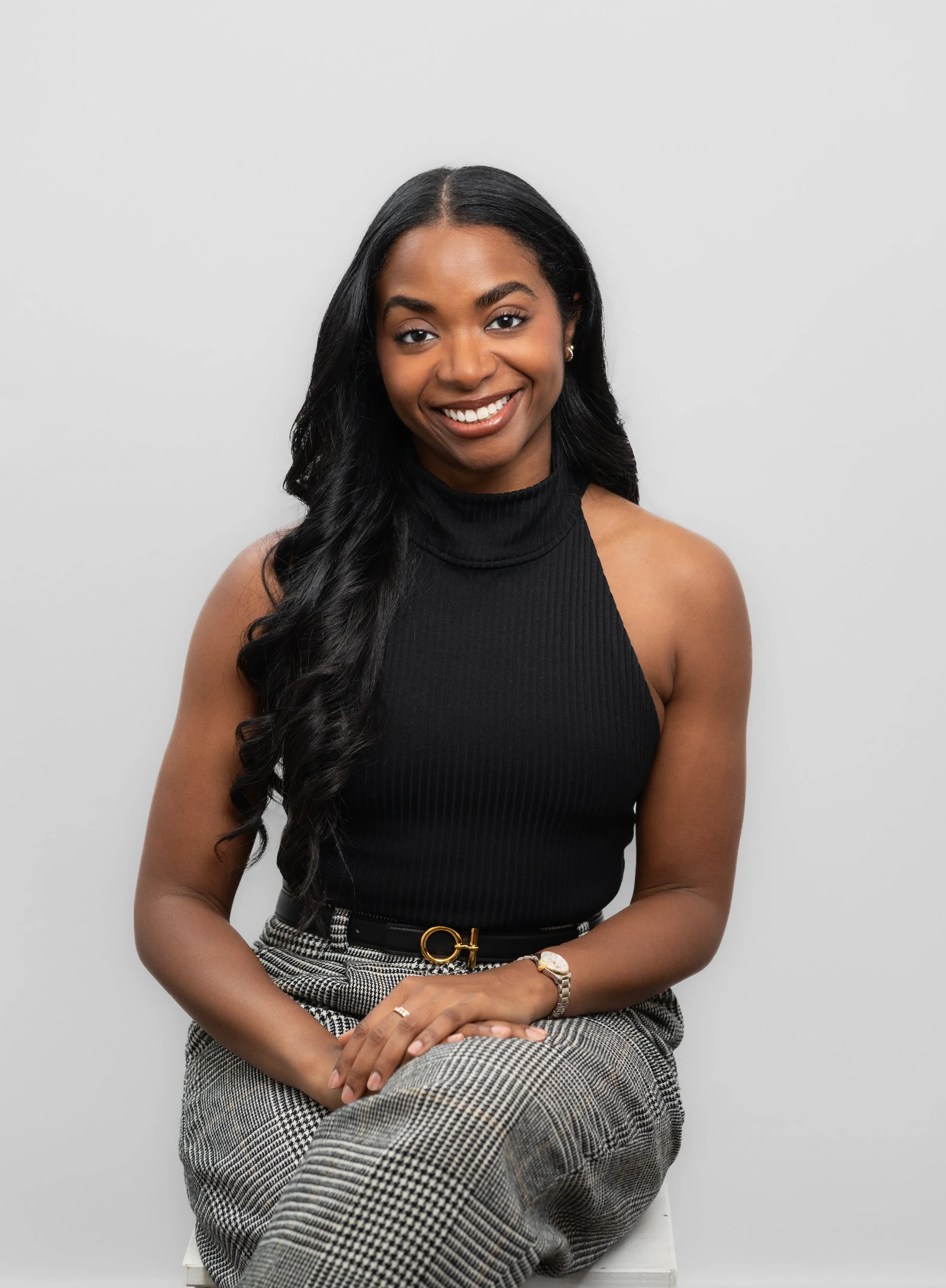 Birth doula sitting down and smiling