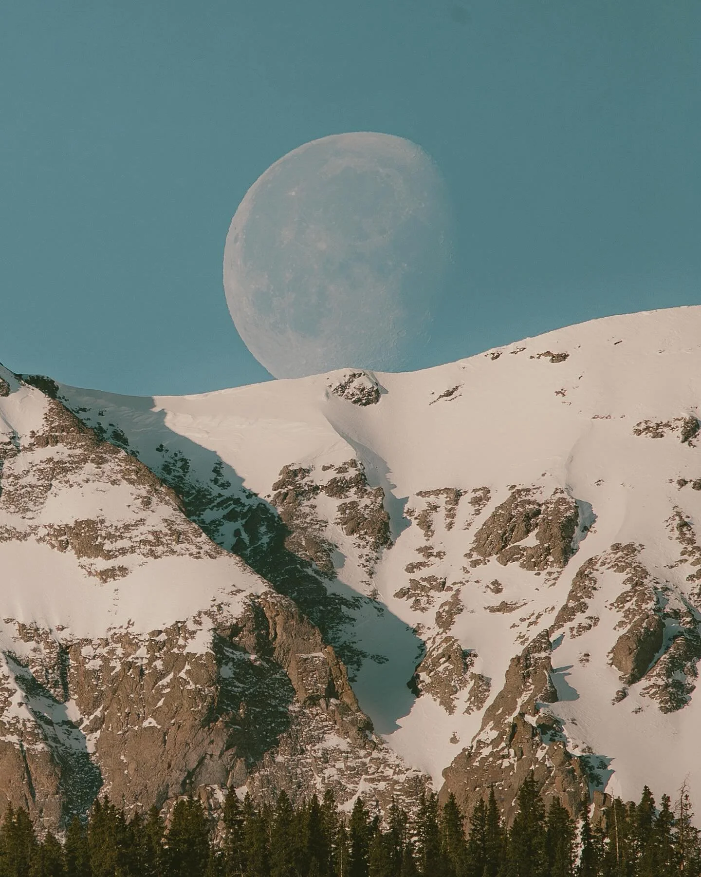 Happy Moonday! 
I took these pictures this morning. 

When I looked out from my bedroom window, I could see the moon about to go behind Grand Turk (the mountain in the photo) I ran downstairs as fast as I could and grabbed my 600mm lens. I don&rsquo;