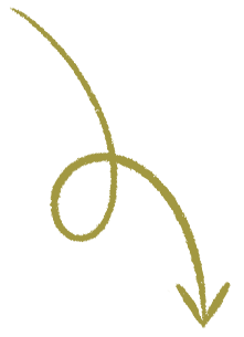 Close-up of a delicate gold decorative swirl ornament with a curling design.