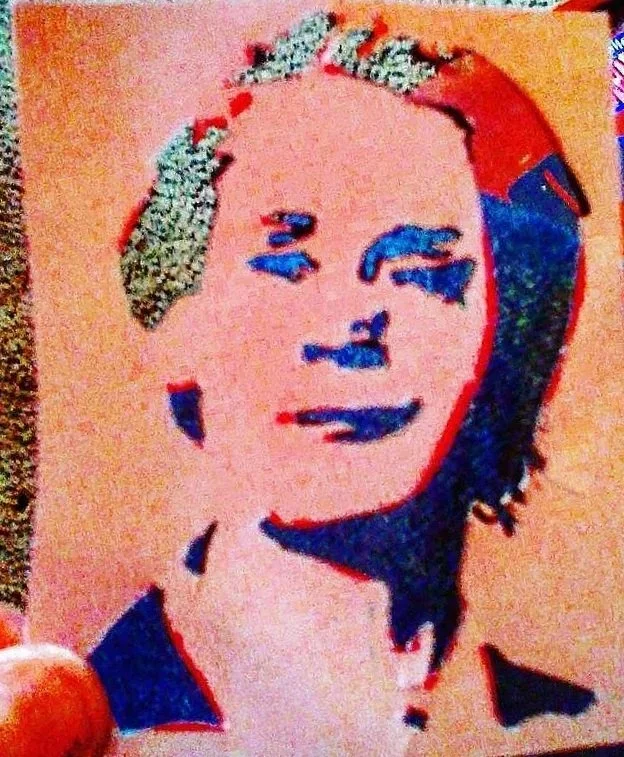 An abstract drawing of a woman with dark hair, sketched with blue and red markings on a light background.