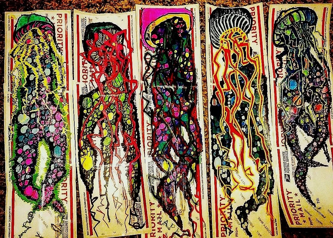 Colorful abstract drawings of lizard shapes on USPS Priority Mail labels.