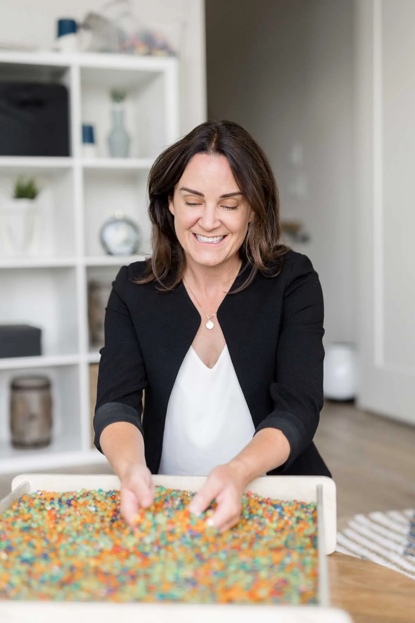 Psychologist using sensory-based activities during OCD therapy at Ten Child Psychology in Calgary