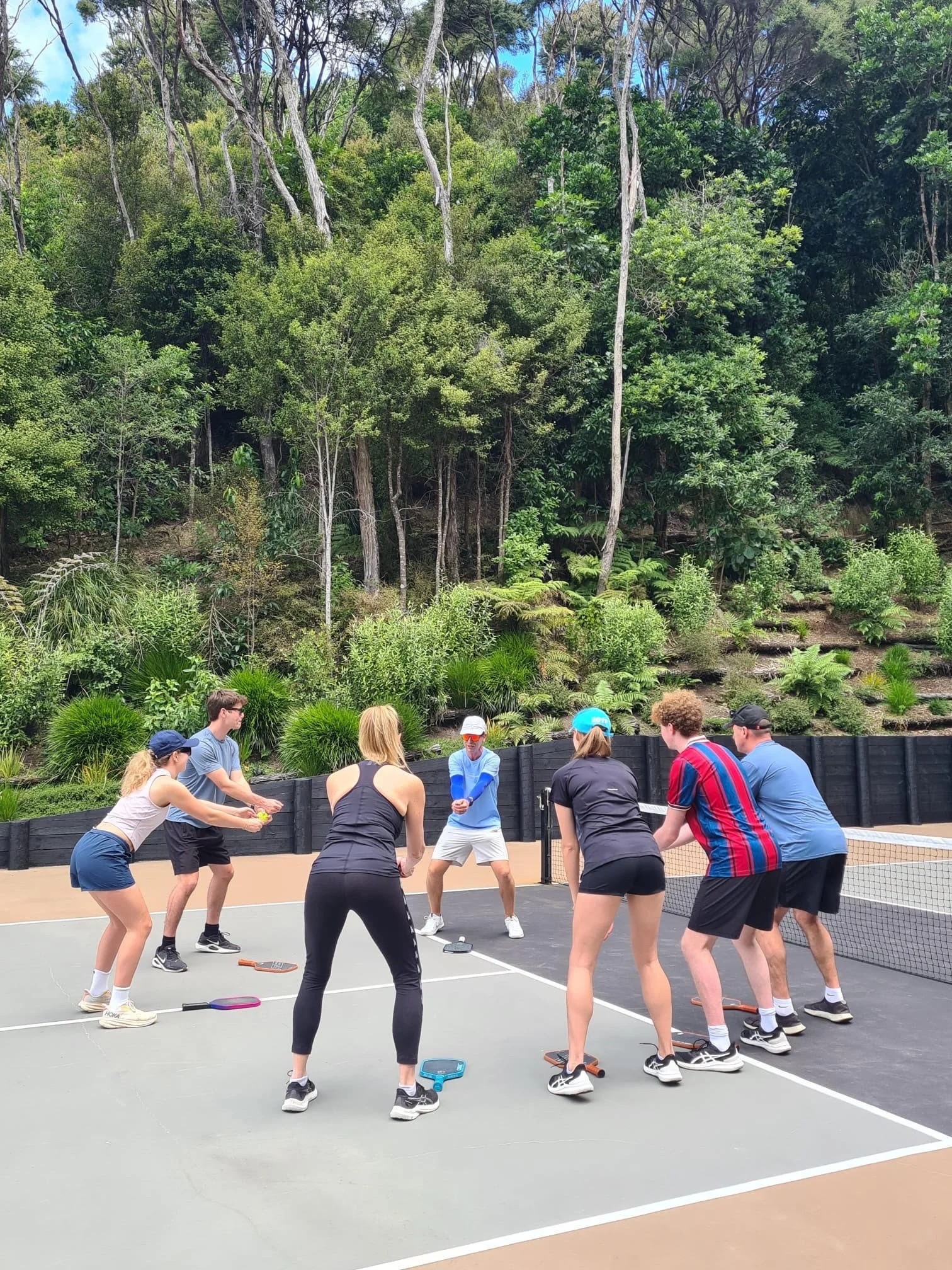 Coach Luke teaching ready position to pickleball students