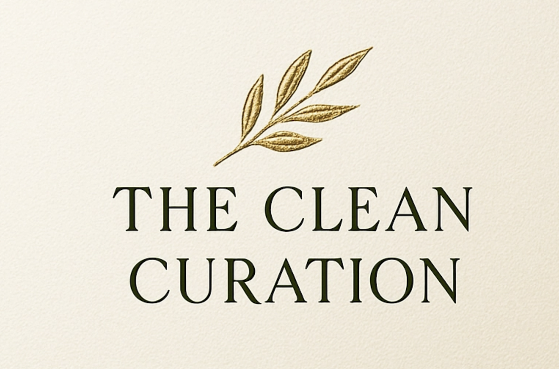 Logo for The Clean Curation featuring a gold leaf illustration above the text.