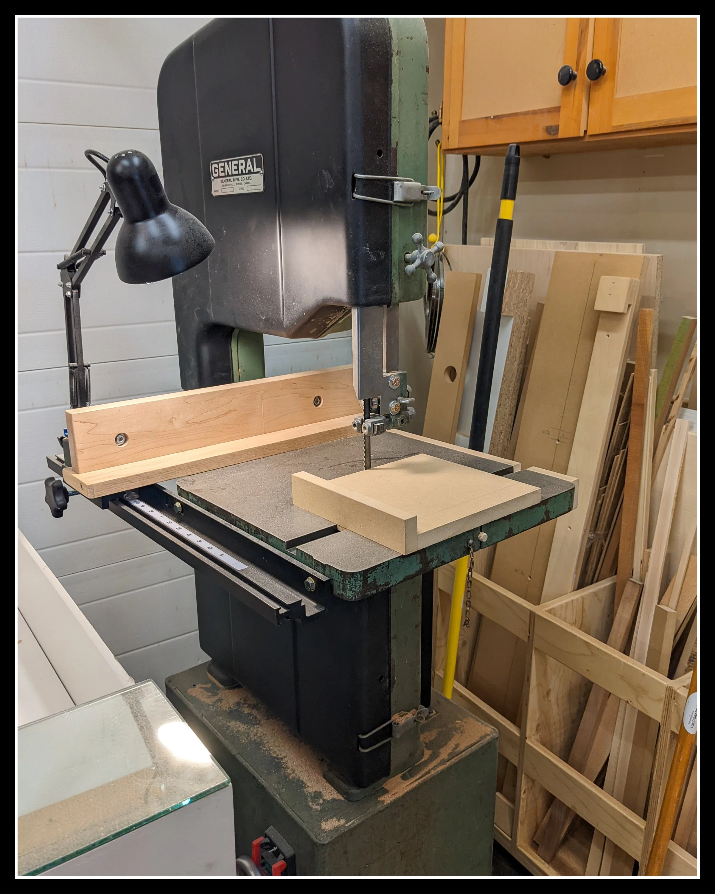General 490 bandsaw in a workshop with a new fence and light installed, showing a tuned and reliable Canadian cast‑iron machine ready for precise woodworking cuts.