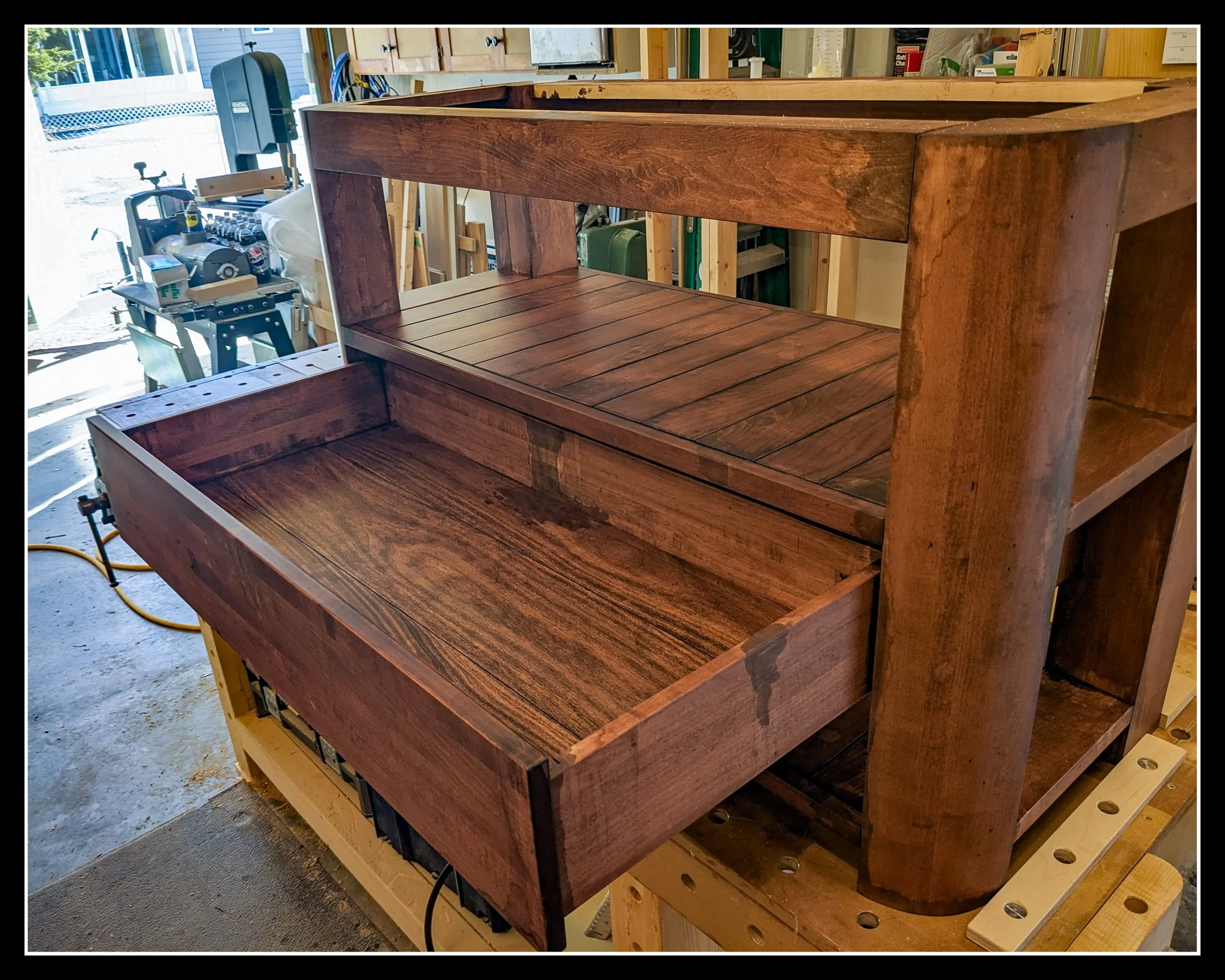 Distressed maple vanity with aged water‑stain texture on the drawer, designed to look worn and restored.