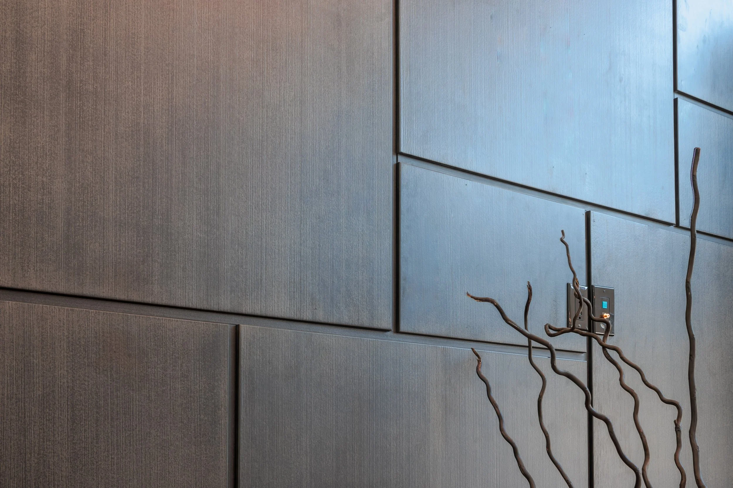 Textured MDF wall panels finished with brushed surface, paint, glaze, and clear coat, representing the Deep Scraped Collection and the creative freedom modern woodworking machines provide.