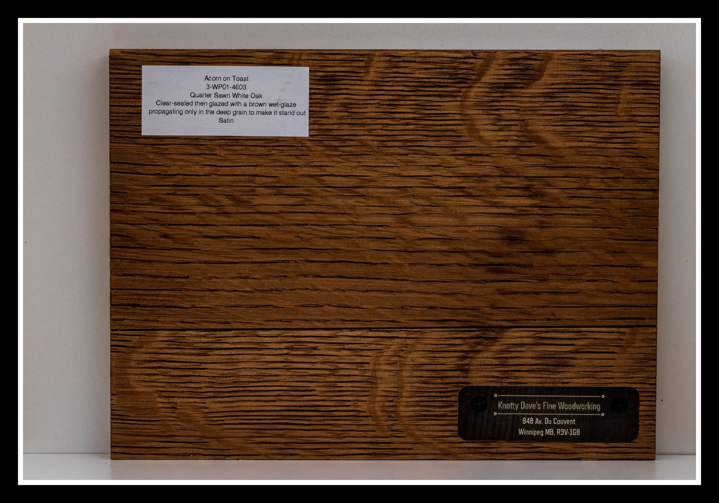 Quarter‑sawn white oak sample in the “Acorn on Toast” layered stain and clear‑coat finish, with brushed grain, deep texture, brown glaze in the low spots, and a satin sheen. Deep Scraped Collection (DSC).