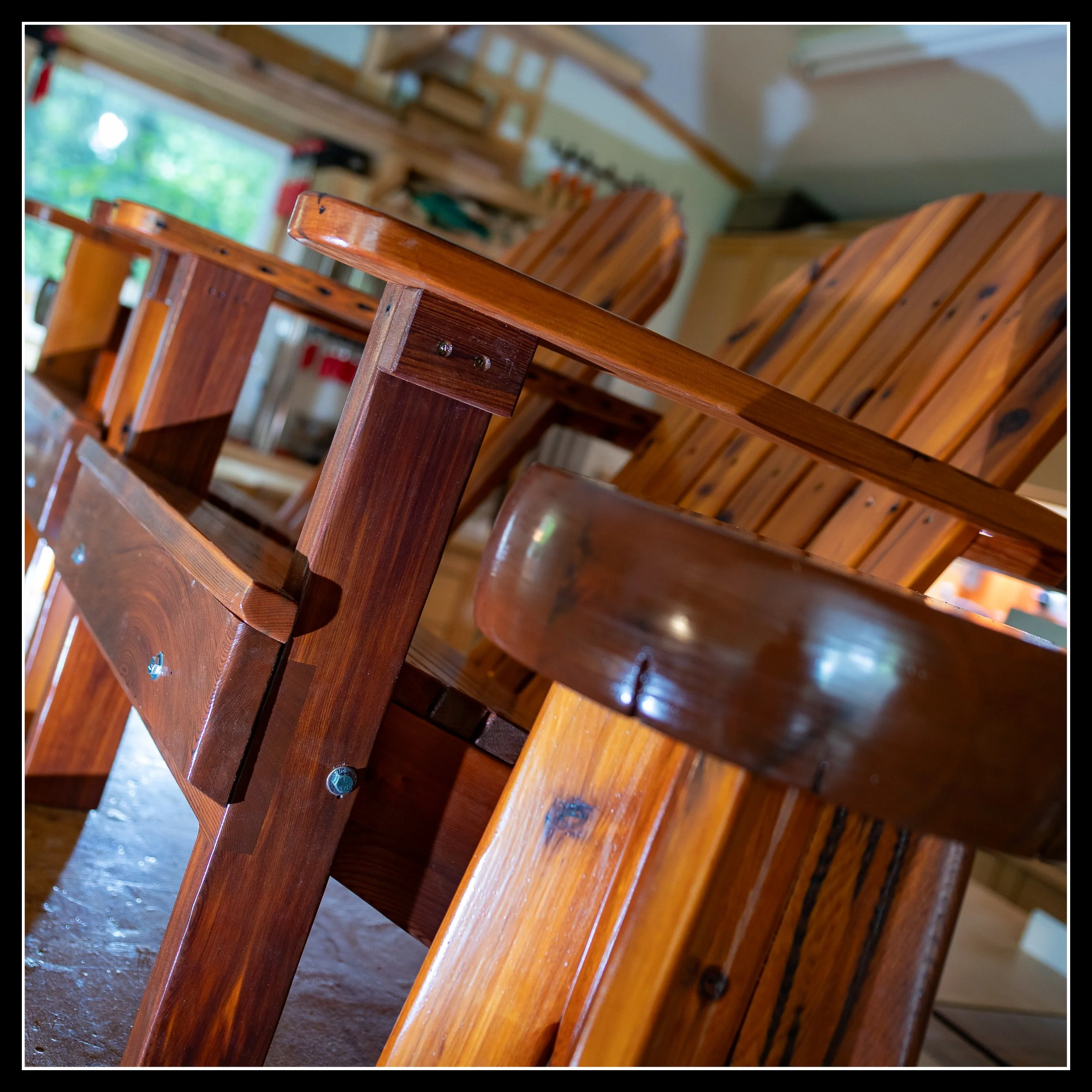 Reclaimed cedar chair showing deep rich stain and tinted long‑oil finish, highlighting warm grain, heritage colour, and shop‑built craftsmanship.