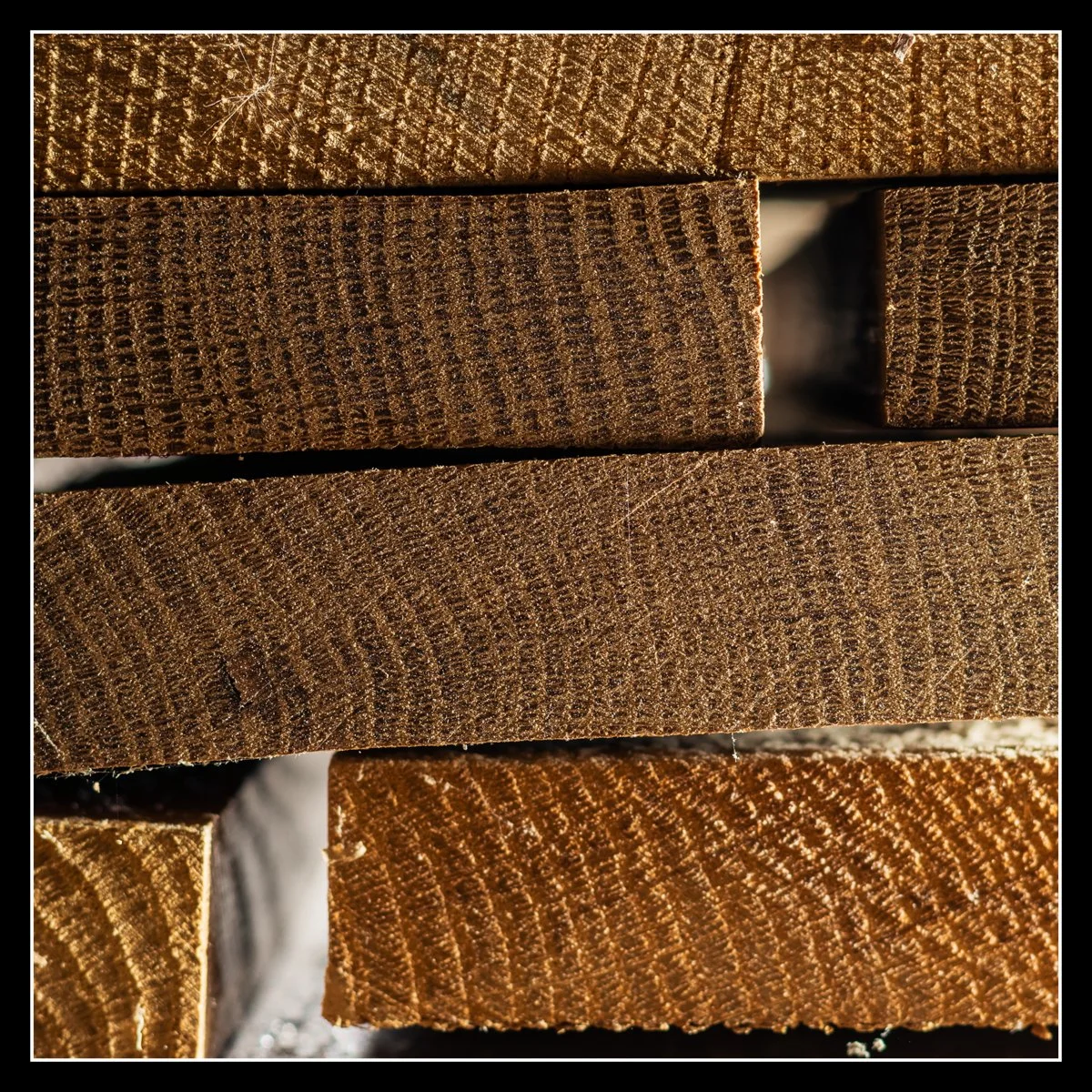 Pile of rough hardwood boards