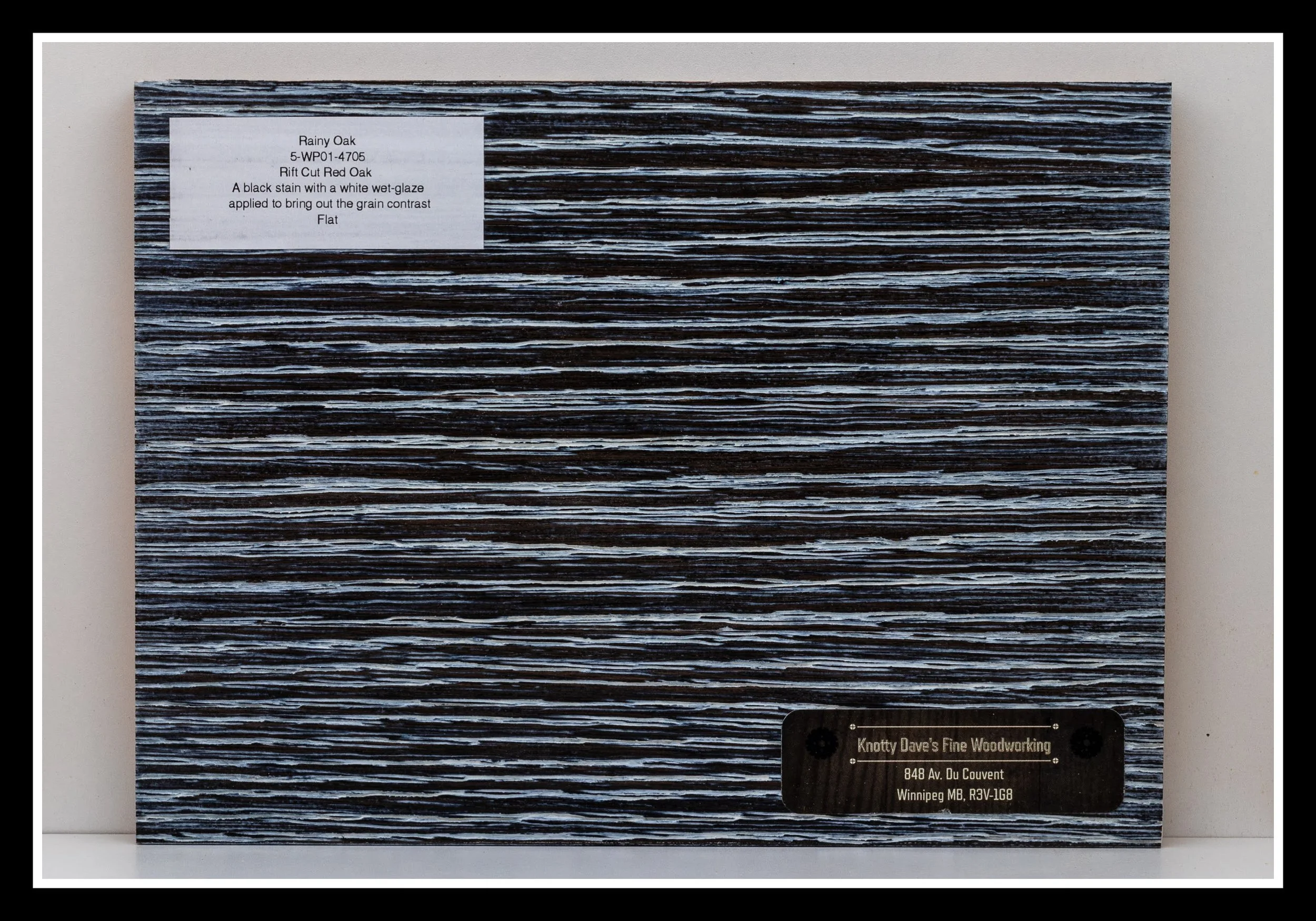 Close‑up of red oak wood grain with deep brushing, black stain, white wipe glaze, open pores, and a satin 2K poly finish.