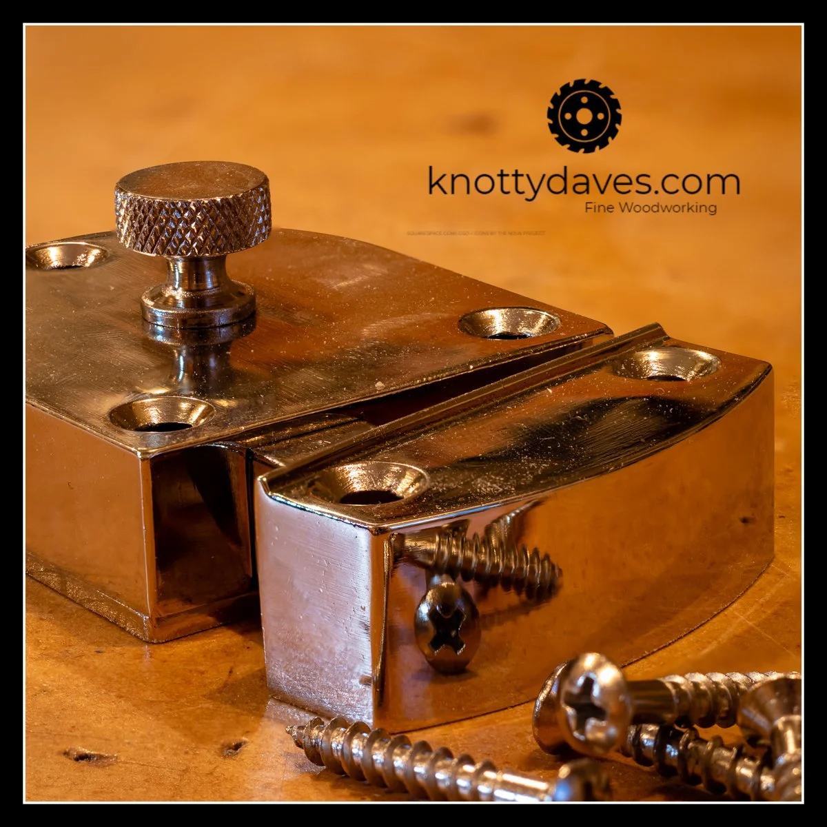 Close-up of a shiny, metallic woodworking jig with screws and a knurled adjustment knob on a wooden surface, with the logo and website of knottydaves.com in the background.