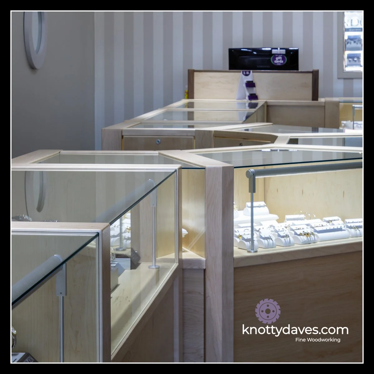 Maple jewellery store display cabinetry with glass tops, clean geometric layout, and durable construction designed for long‑term commercial use.