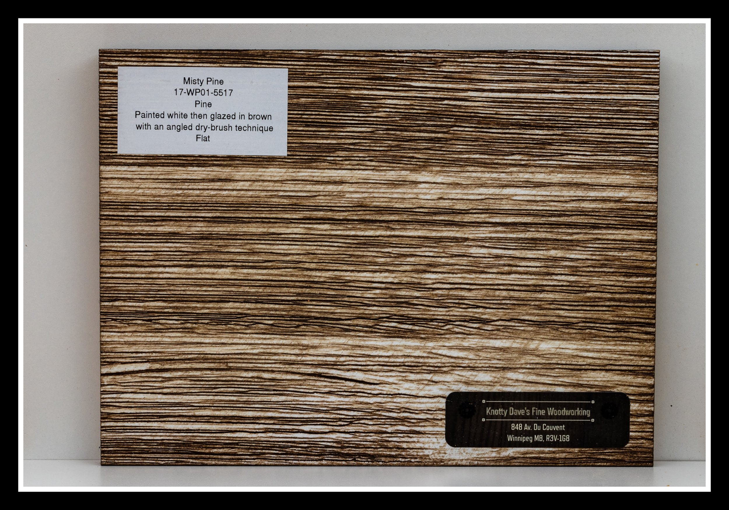 Close‑up of Misty Pine wood grain with deep scraping, white layered finish, brown glaze, brushed texture, and a 2K poly seal.