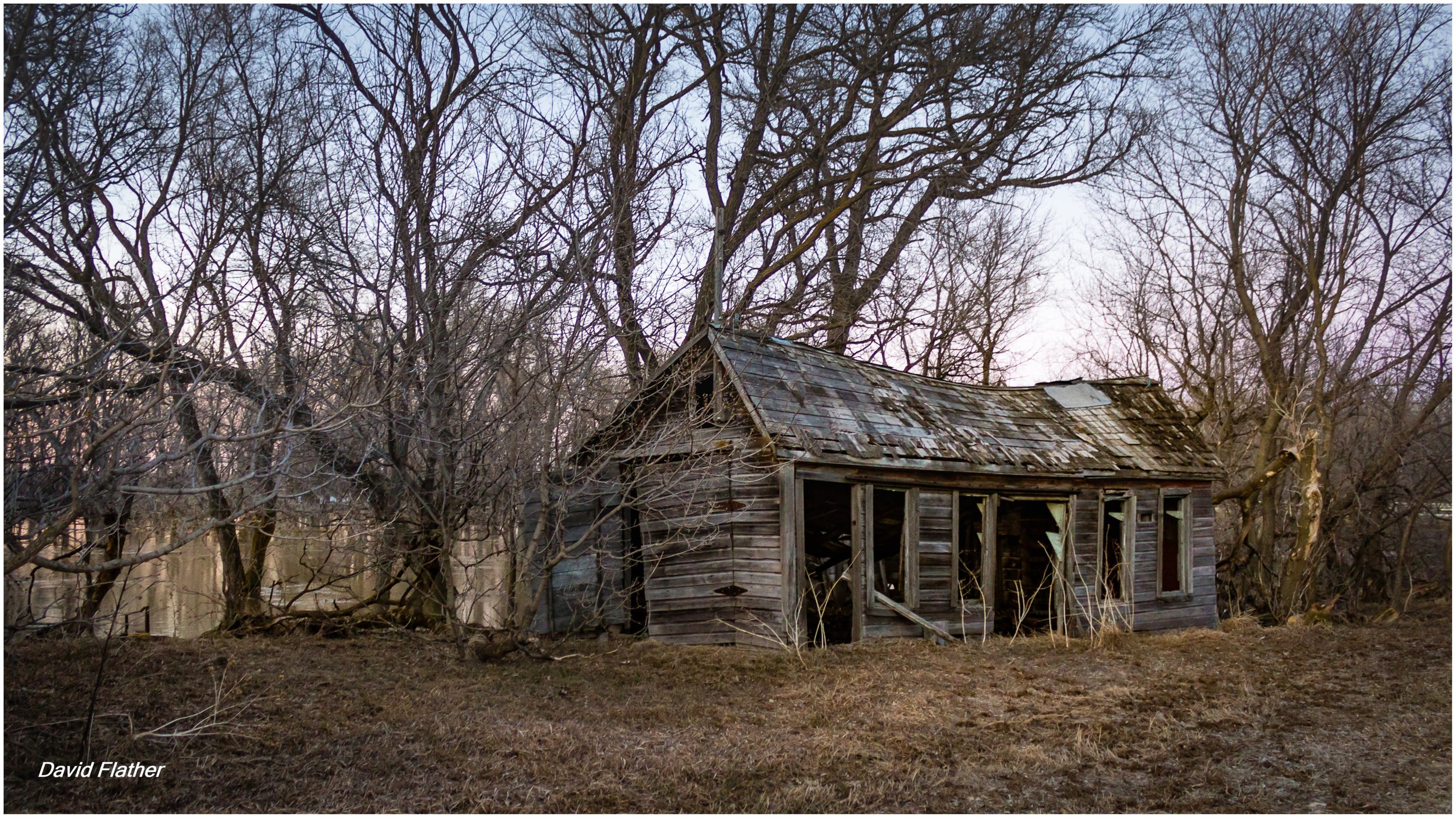 Old rural house on the La Salle River, likely 1880s–1890s, built from bur oak to survive repeated spring flooding.