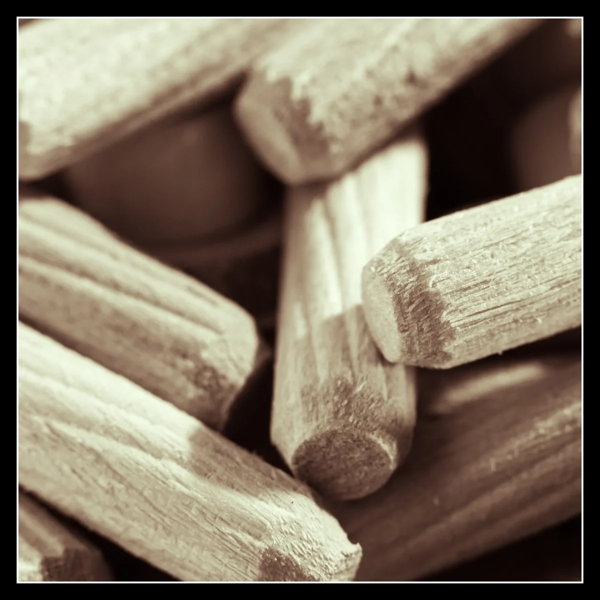 Wooden dowels symbolizing the small, steady pieces of craft and effort needed to face a crooked, decades‑old crawl space and try to make it right.