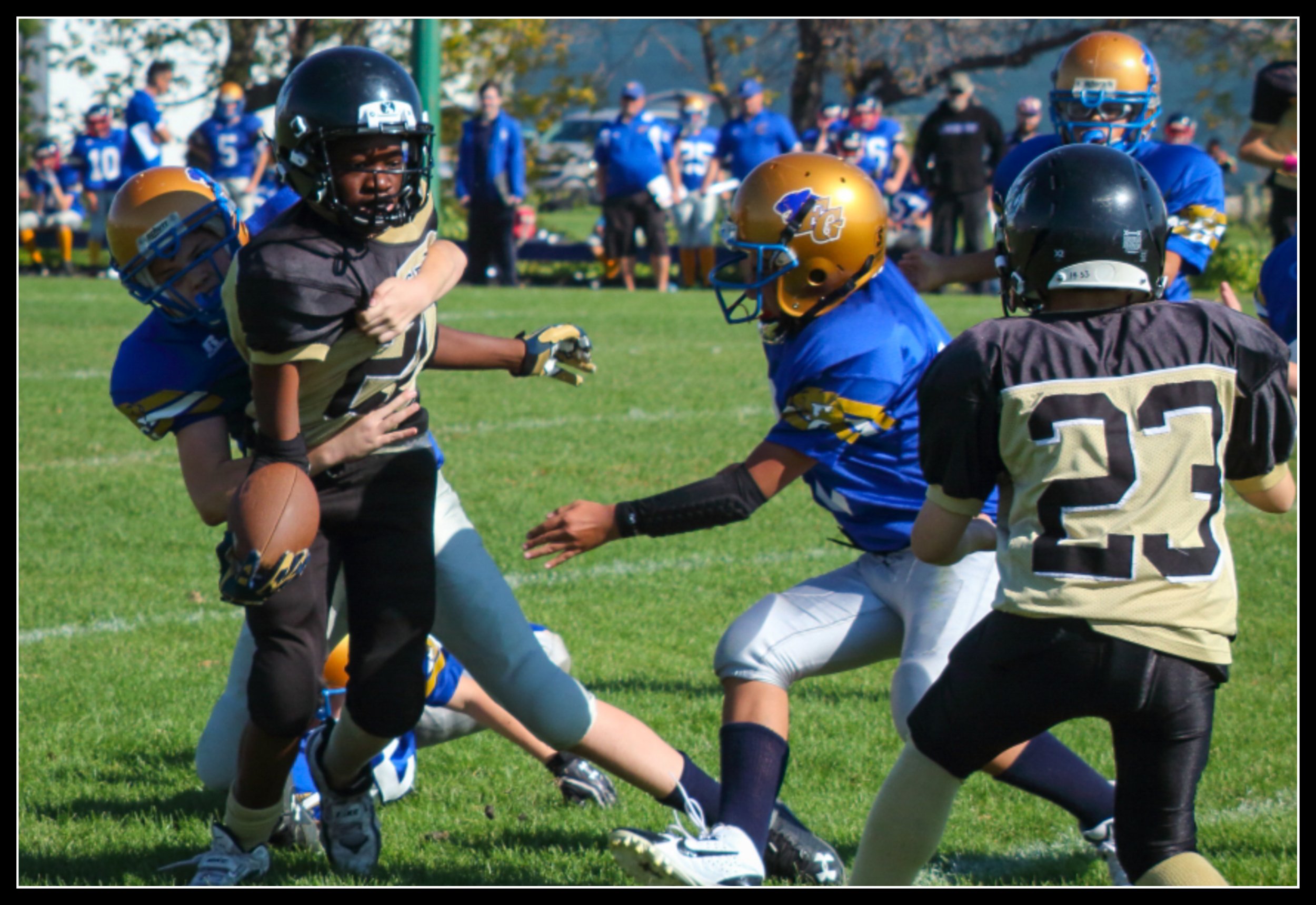 Youth football game where the name ‘Knotty Dave’ originated, capturing the sideline world that shaped the brand.