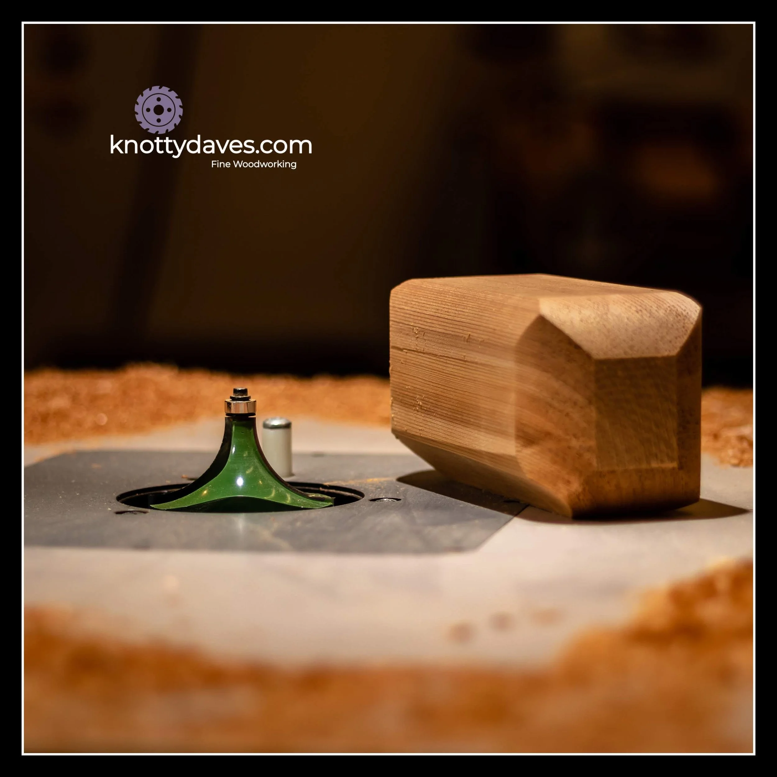 Close-up of a wood router table in use, a wooden block on a workbench, woodworking saw blade, and shavings.