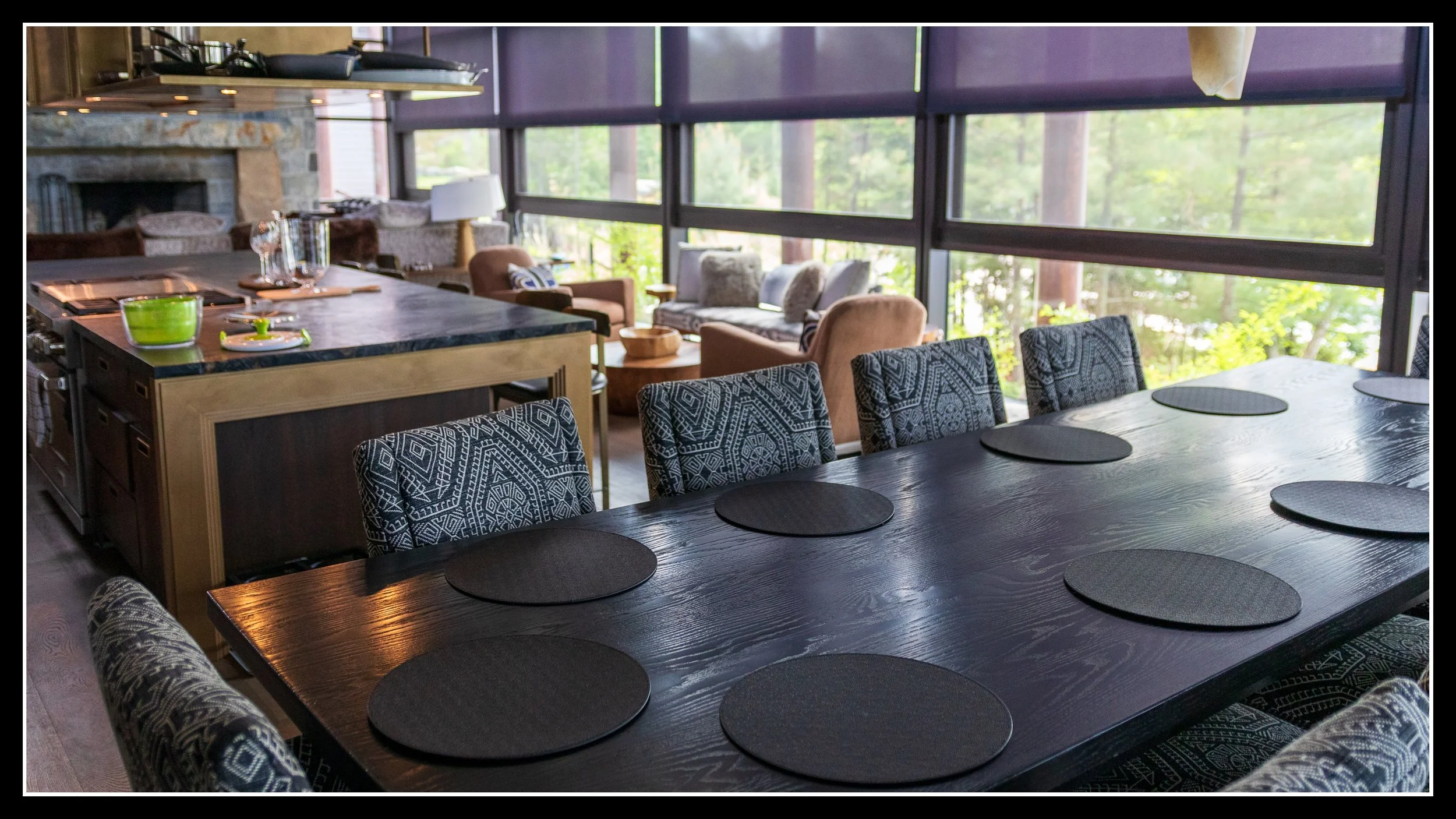 12‑foot solid red oak dining table with dark‑stained hardwood top in a modern dining room.