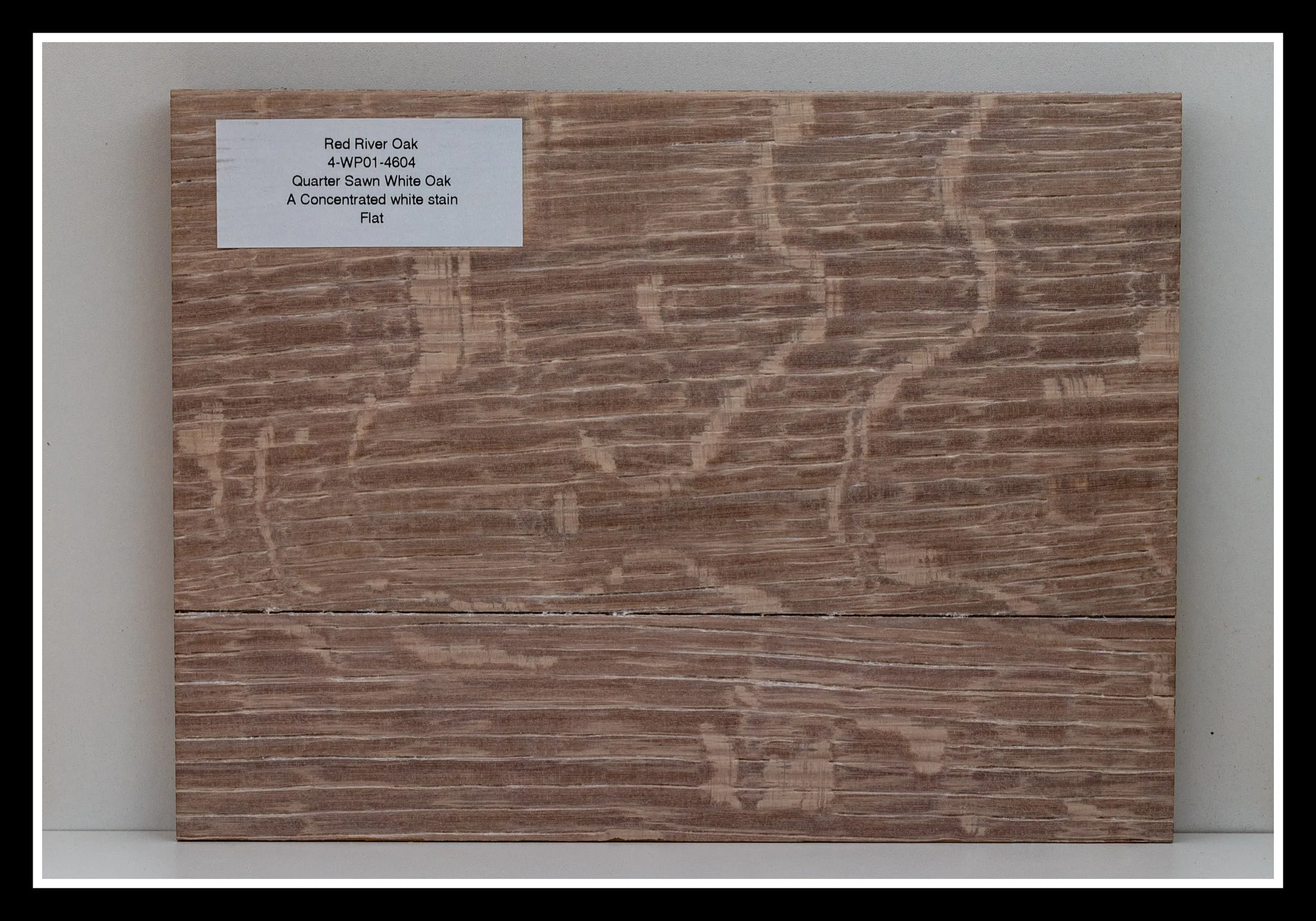 Quarter‑sawn white oak sample in the “Red River Oak” layered stain, glaze, and clear‑coat finish, with brushed grain, deep texture, and a concentrated white stain. Deep Scraped Collection (DSC).