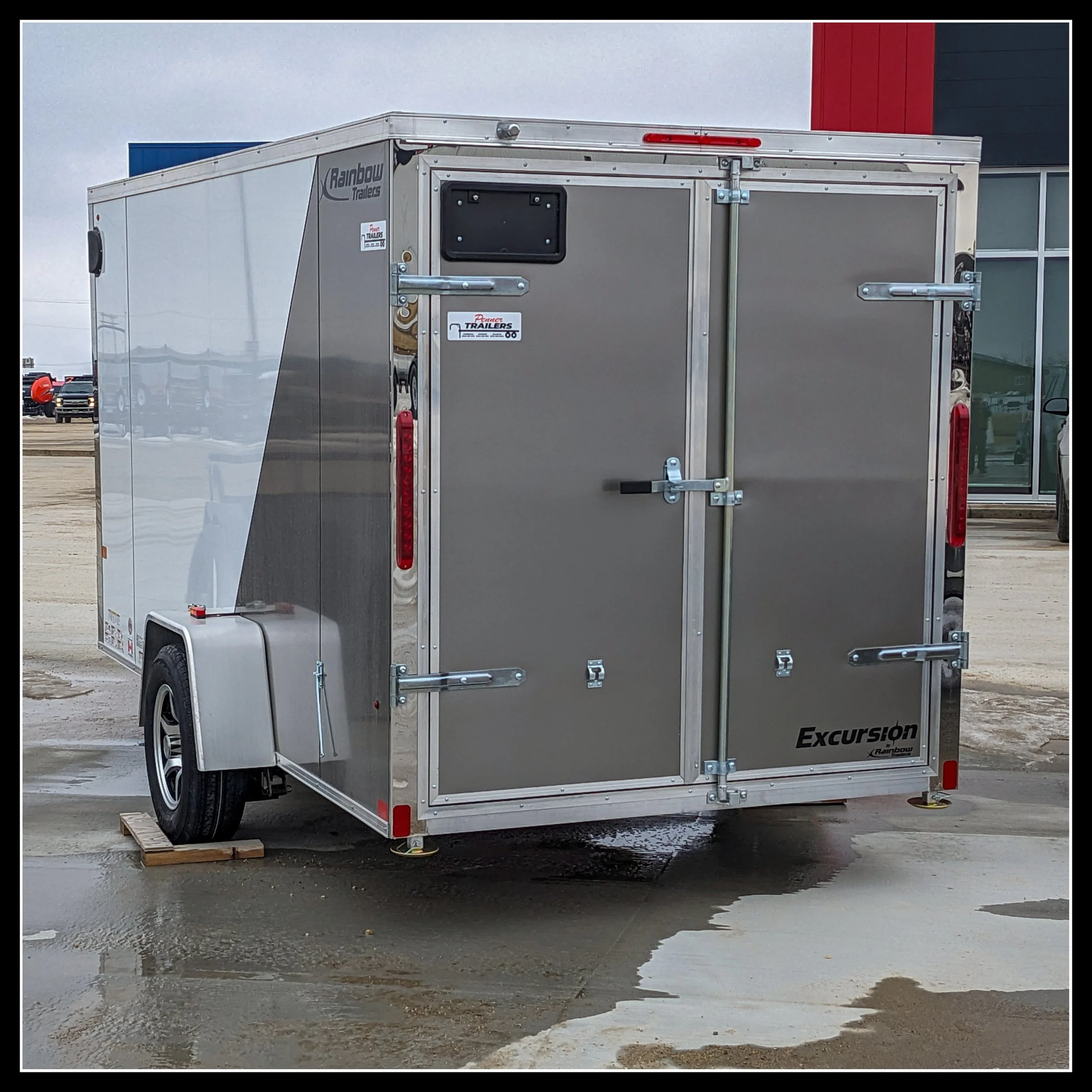 12-foot cargo trailer used as overflow storage for a small Winnipeg woodworking shop, representing ingenuity and the evolution of the workspace.