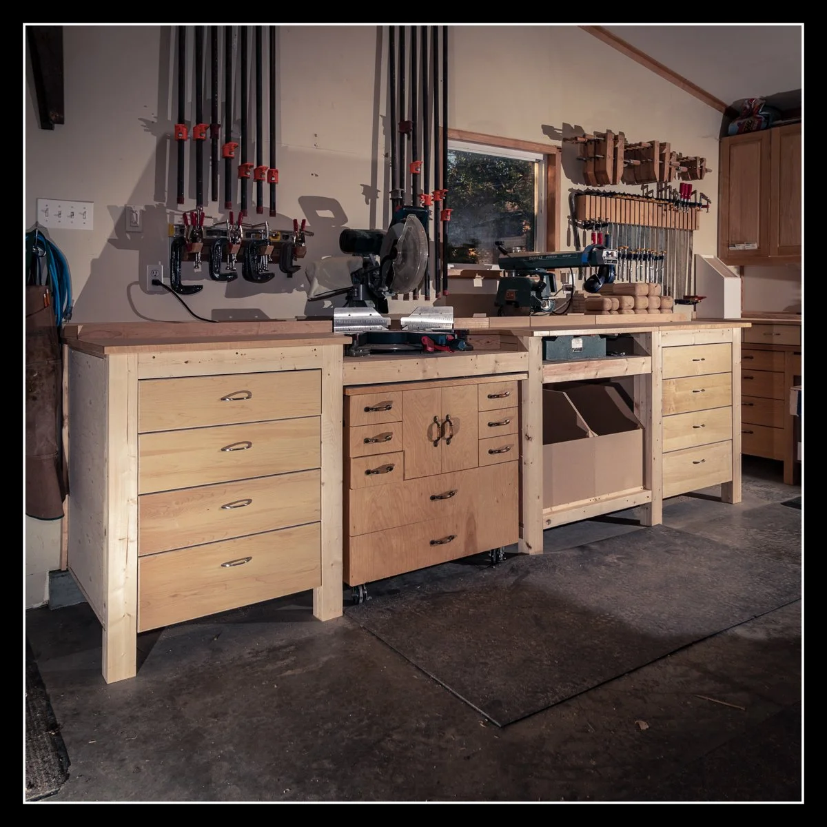Cross‑cut bench with original radial arm saw and mitre saw setup, showing dedicated woodworking station designed for accurate, repeatable cuts.