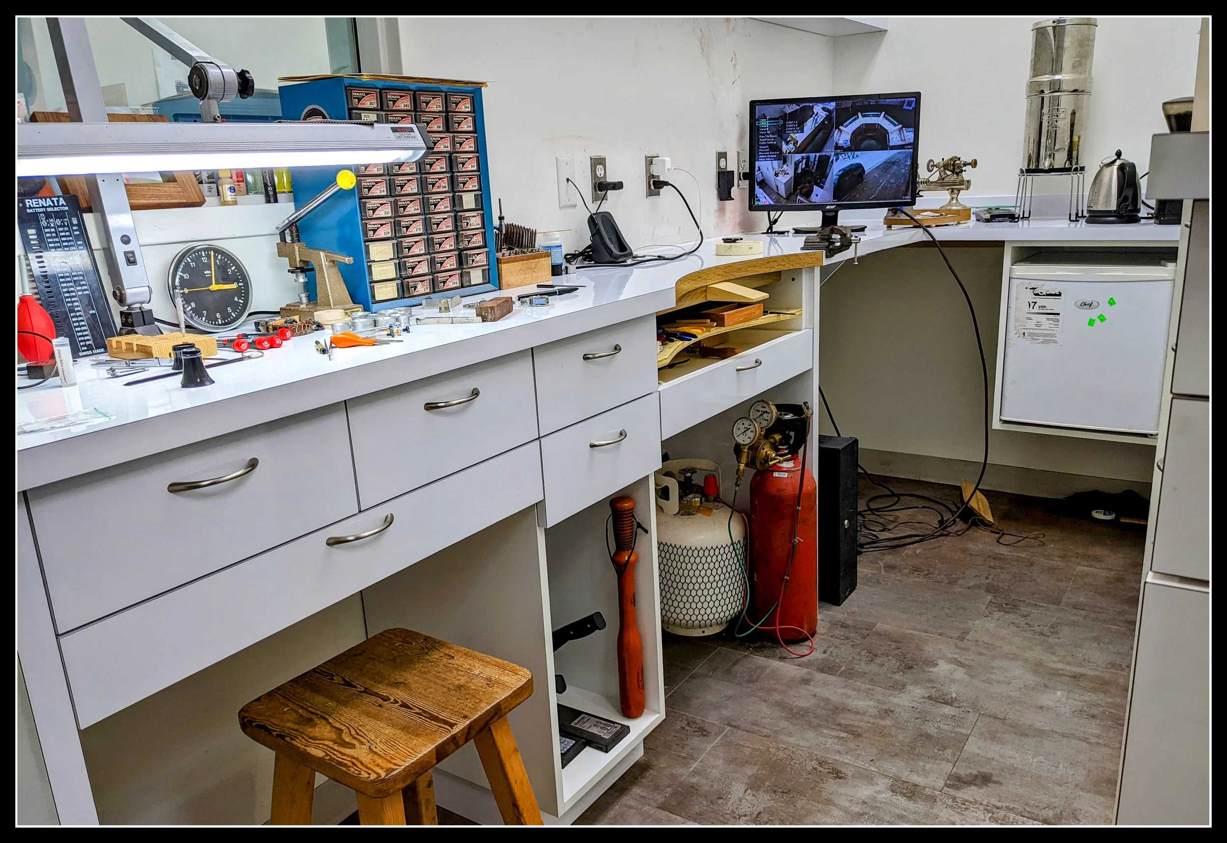 Custom-built woodworking benches in a jewellery store watchmaking room, crafted by Knotty Dave as part of his family’s heritage.