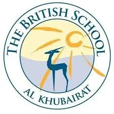 School logo with a blue deer, sun rays, and a sunset or sunrise background, labeled 'The British School, Al Khubar'.