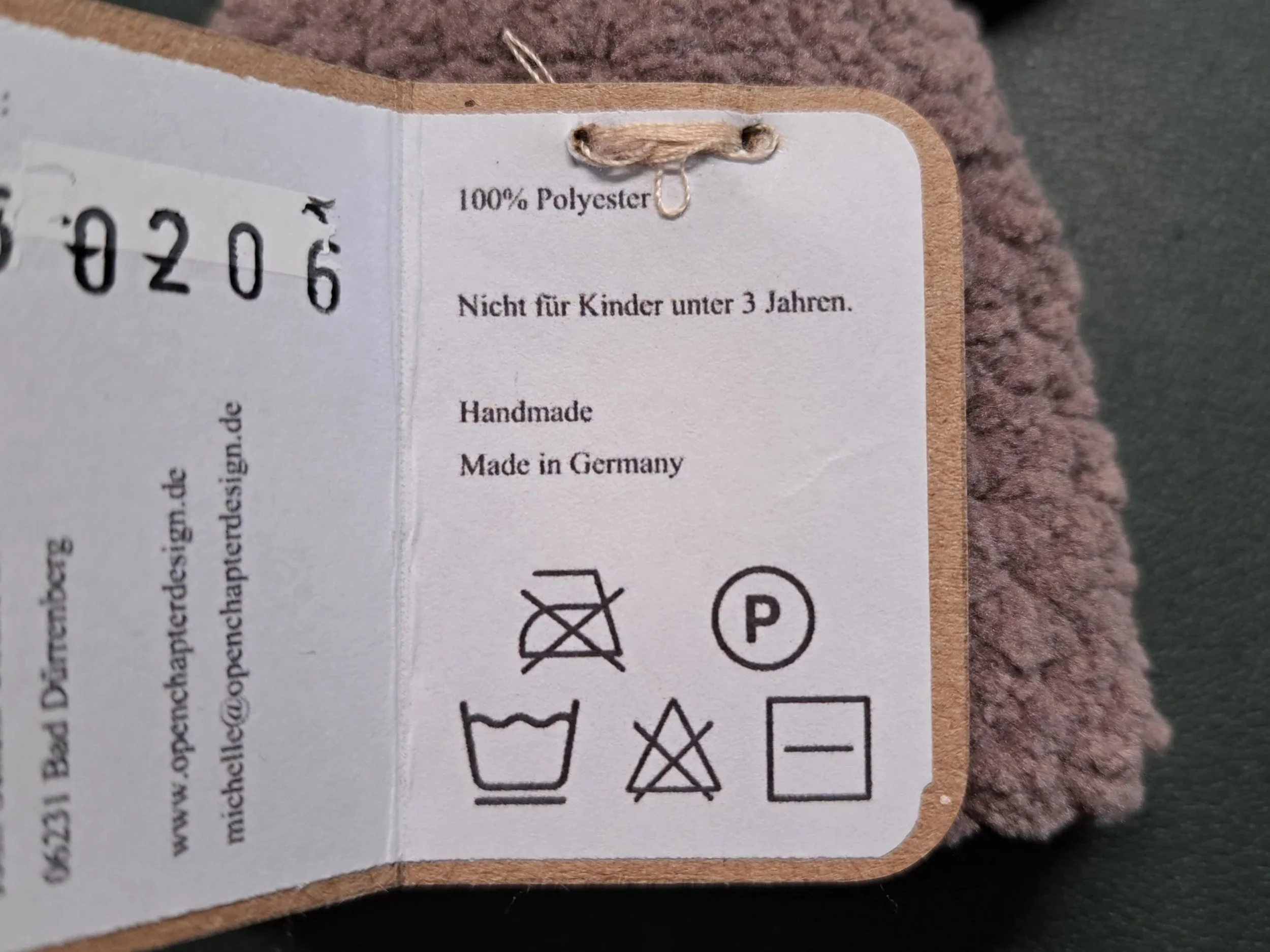 Etikett von den Eierwärmern, mit Waschhinweisen, made in germany und 100% Polyester