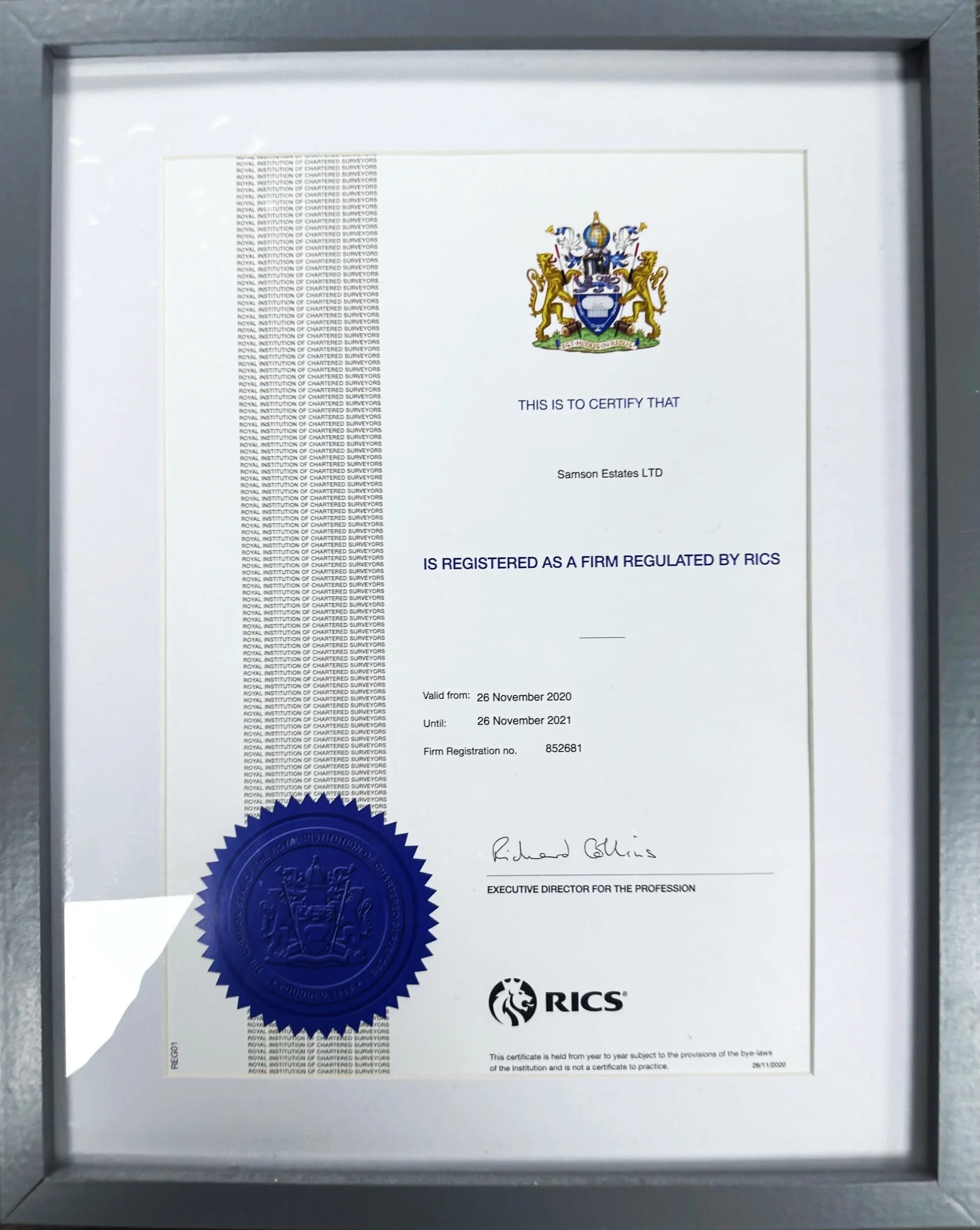 Certificate of registration issued by RICS for Samson Estates LTD, valid from November 26, 2020 to November 26, 2021, with a blue embossed seal, signatures, and a coat of arms at the top.