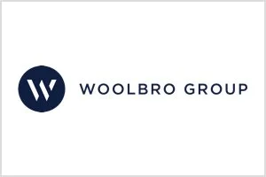 Woolbro Group logo with a navy blue circle containing a white stylized 'W' and the company name beside it.