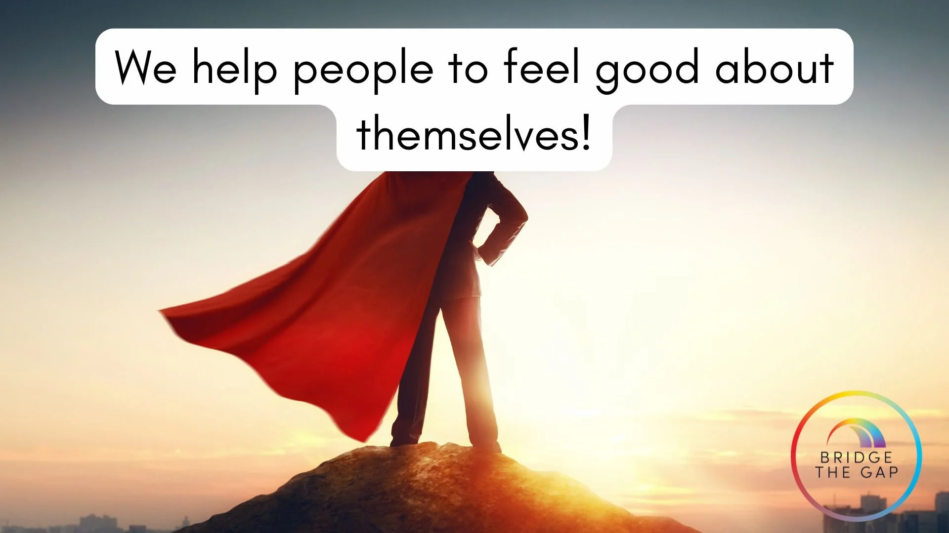 A person dressed as a superhero with a red cape standing on a hilltop during sunset, with the text "We help people to feel good about themselves!" and a rainbow-colored logo reading "Bridge the Gap" in the bottom right corner.