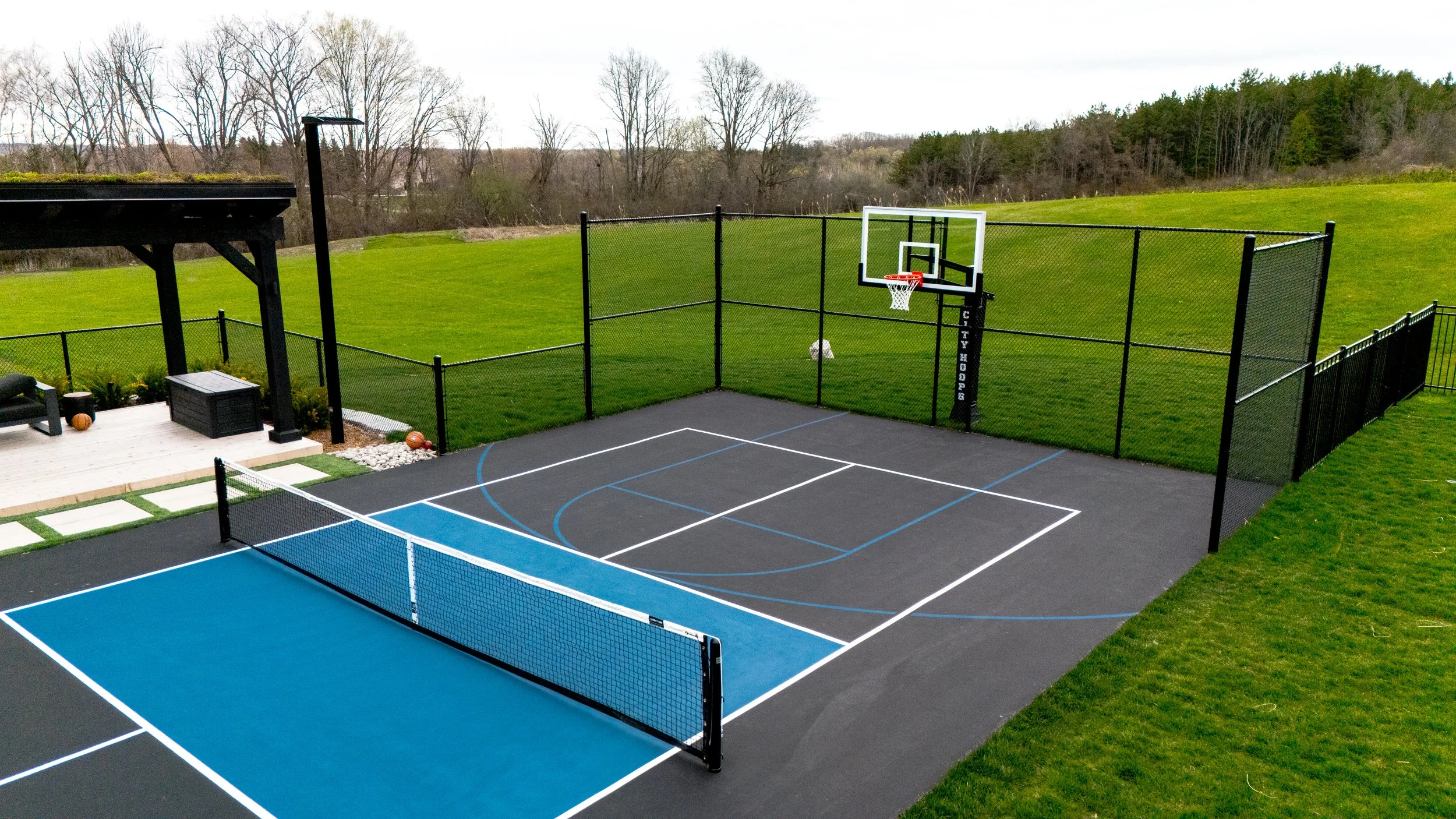 City Hoops Platinum Basketball Hoop with Terminated Fence.jpg
