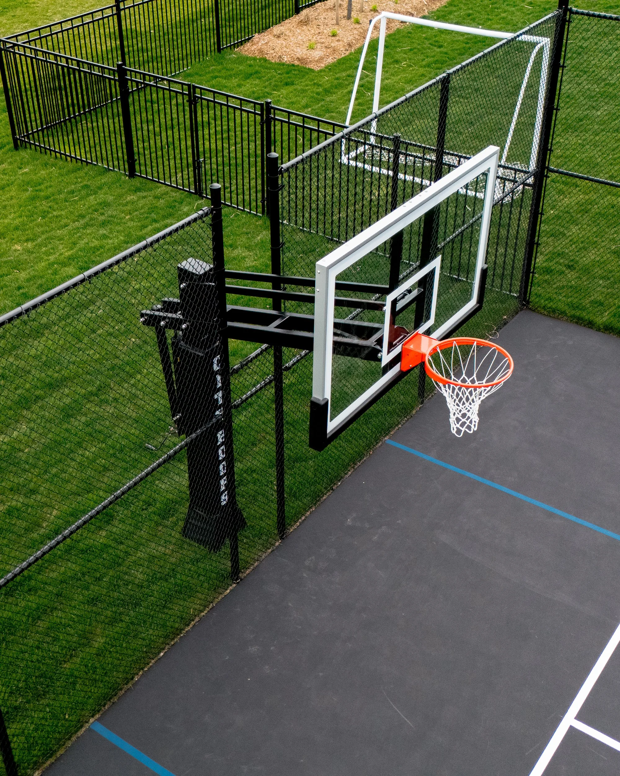 City Hoops Platinum Basketball Hoop with Terminated Fence.jpg