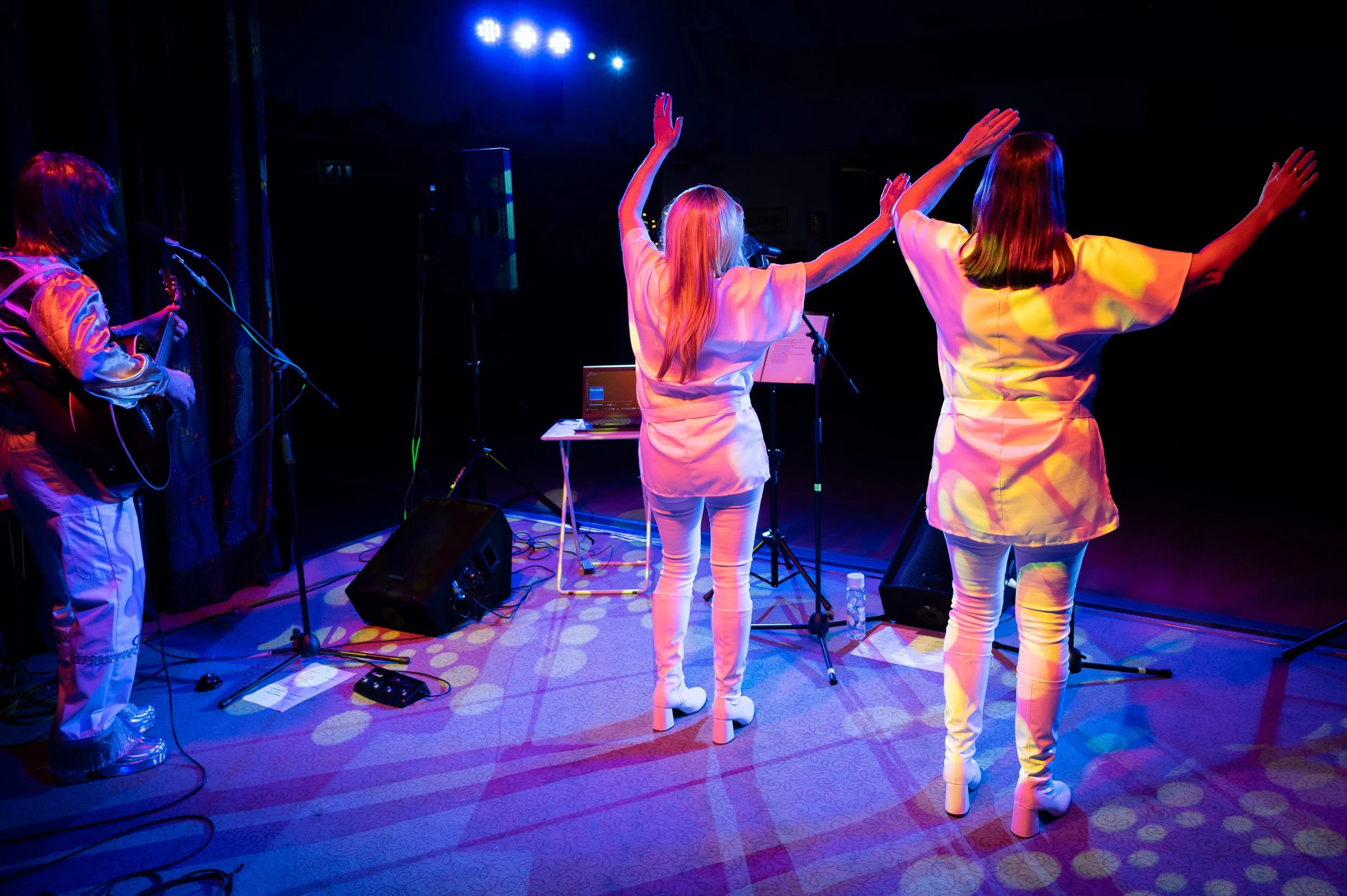 Take A Chance On three performing ABBA song Fernando. live in Milton Keynes in November 2025, as part of their ABBA tribute act.