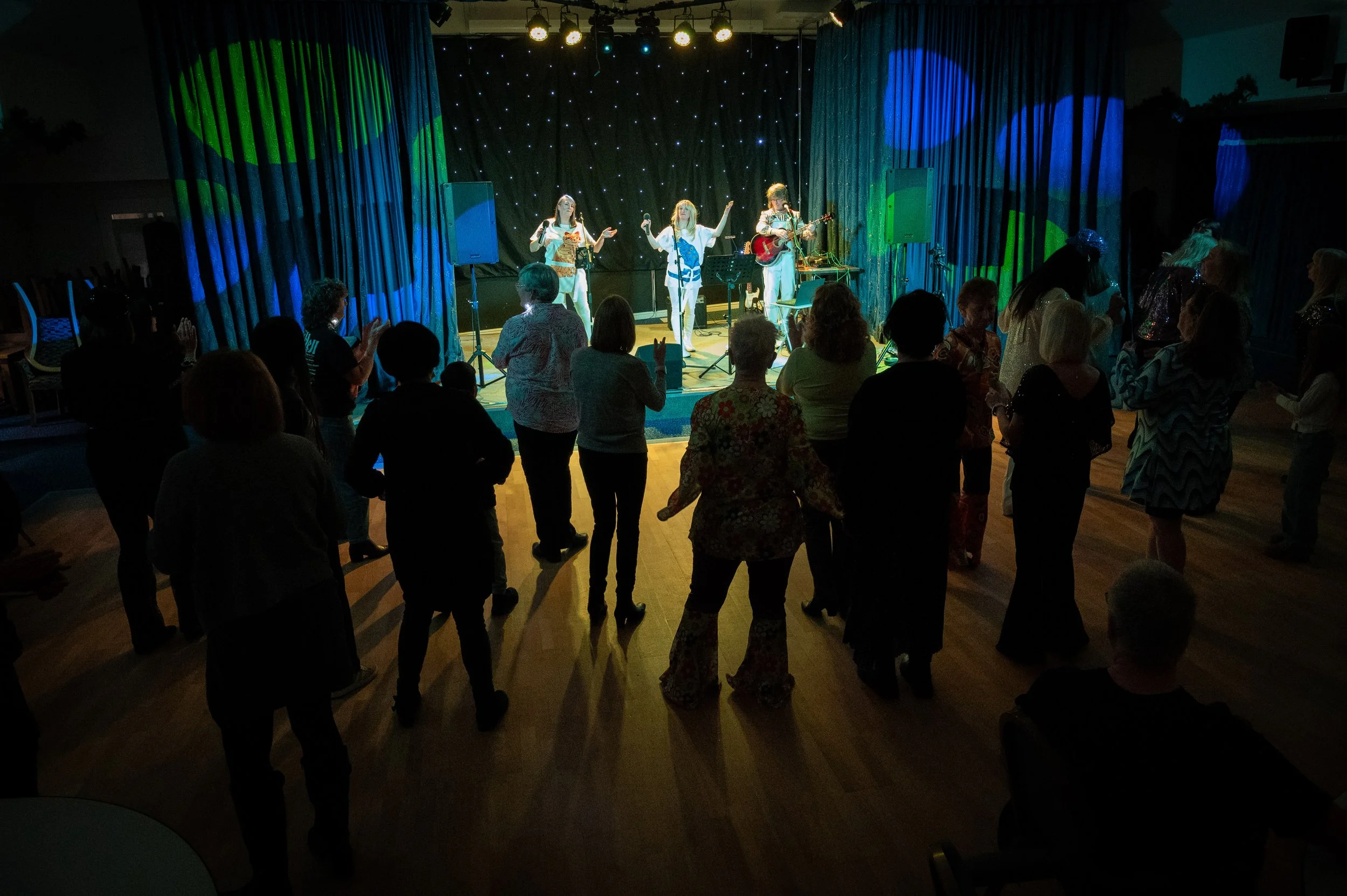 Take A Chance On three performing ABBA song Knowing Me, Knowing You in Milton Keynes in November 2025 as part of their ABBA tribute act.