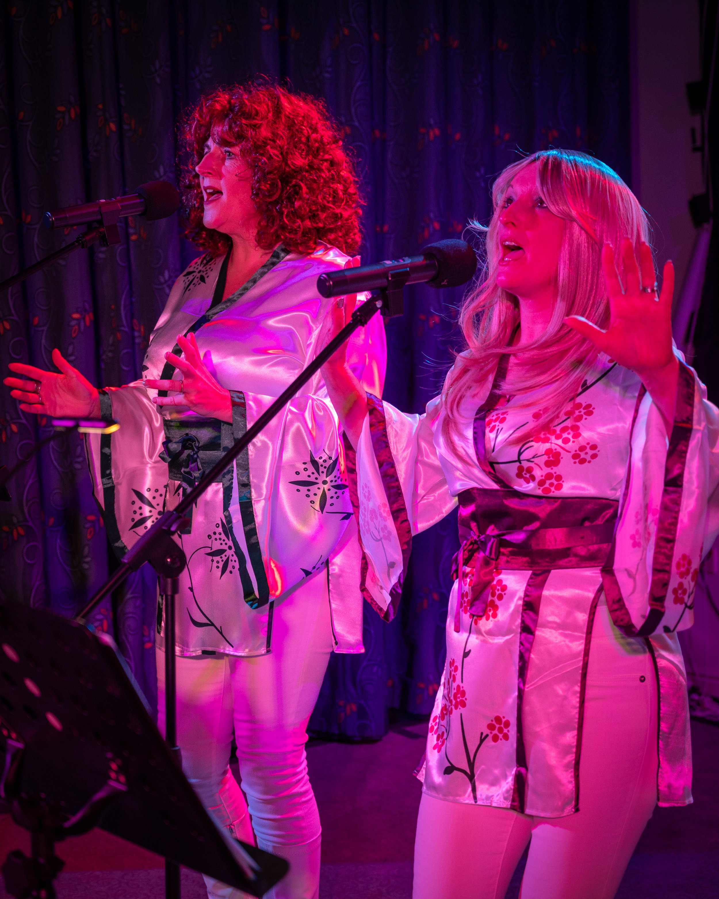 Take A Chance On 3 performing ABBA song Super Trouper live in Milton Keynes in November 2025, as part of their ABBA tribute act.