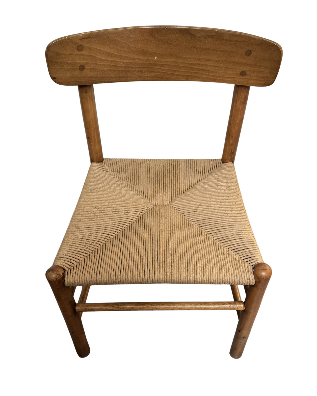 Detail of hand-woven rush seat showing traditional four-corner star pattern.