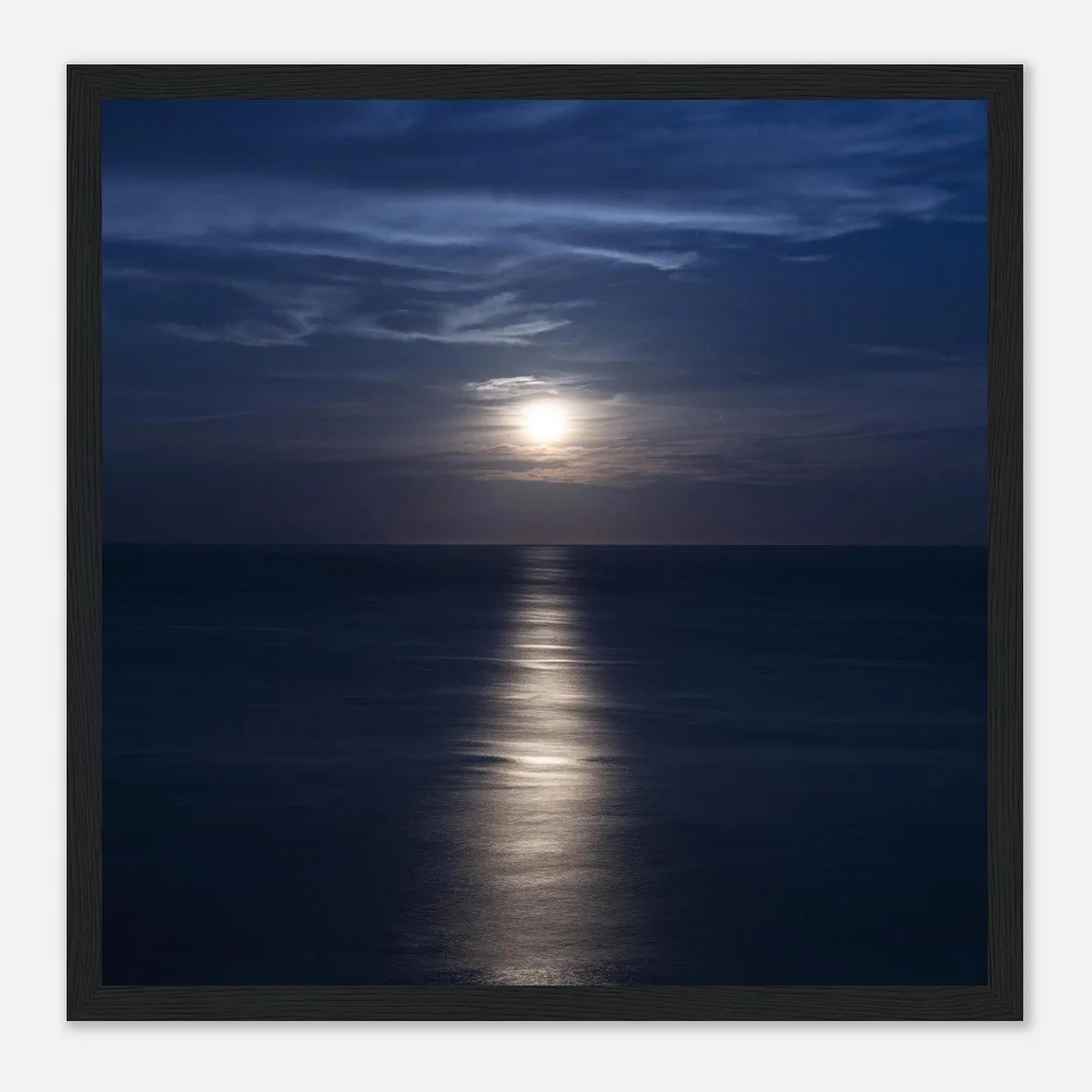 Sunset or sunrise over the ocean with clouds in the sky.