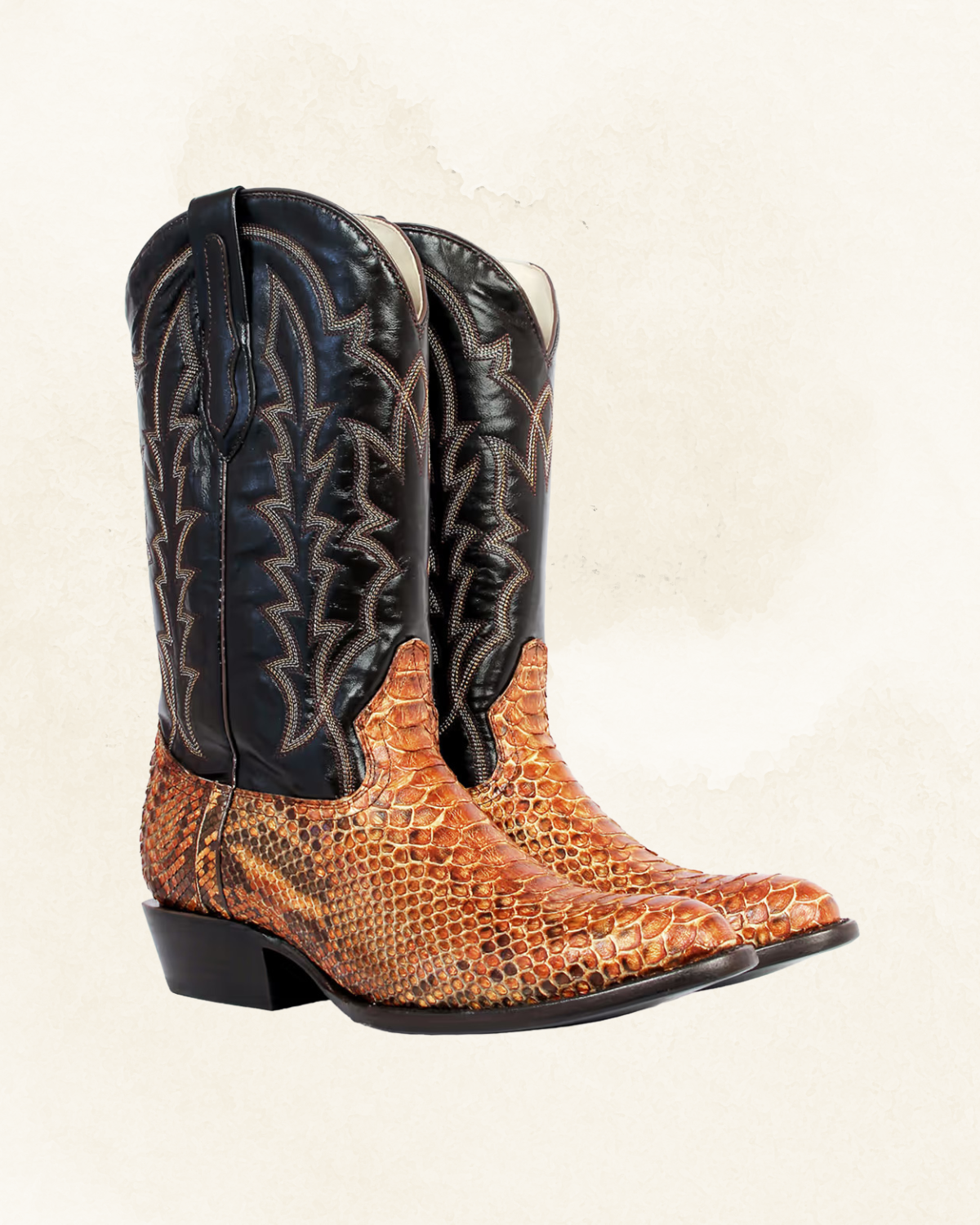 Pair of cowboy boots with snakeskin texture and decorative stitching on the shaft