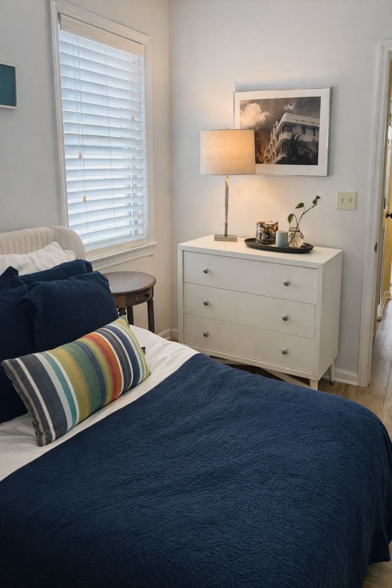 Queen bedroom in the Private Suite features a full closet, dresser and arm chair.  