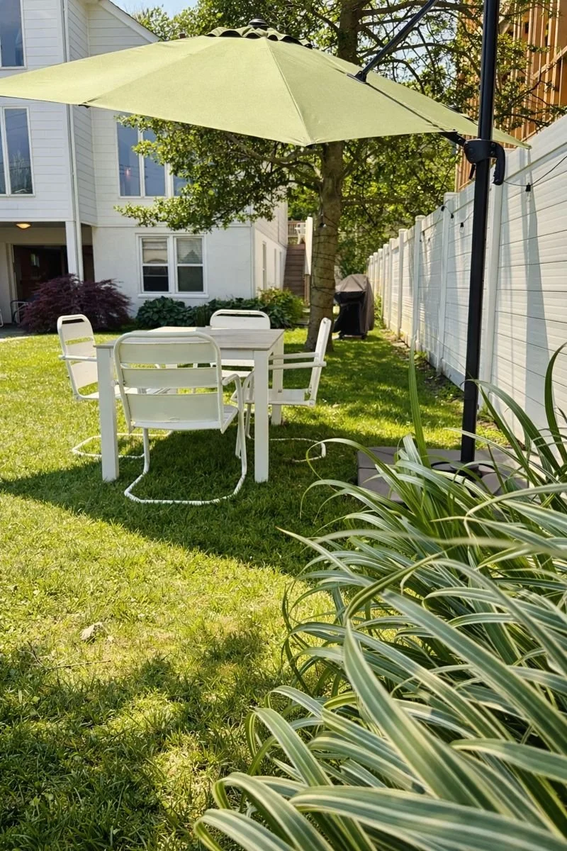 Outdoor dining area with umbrella. 